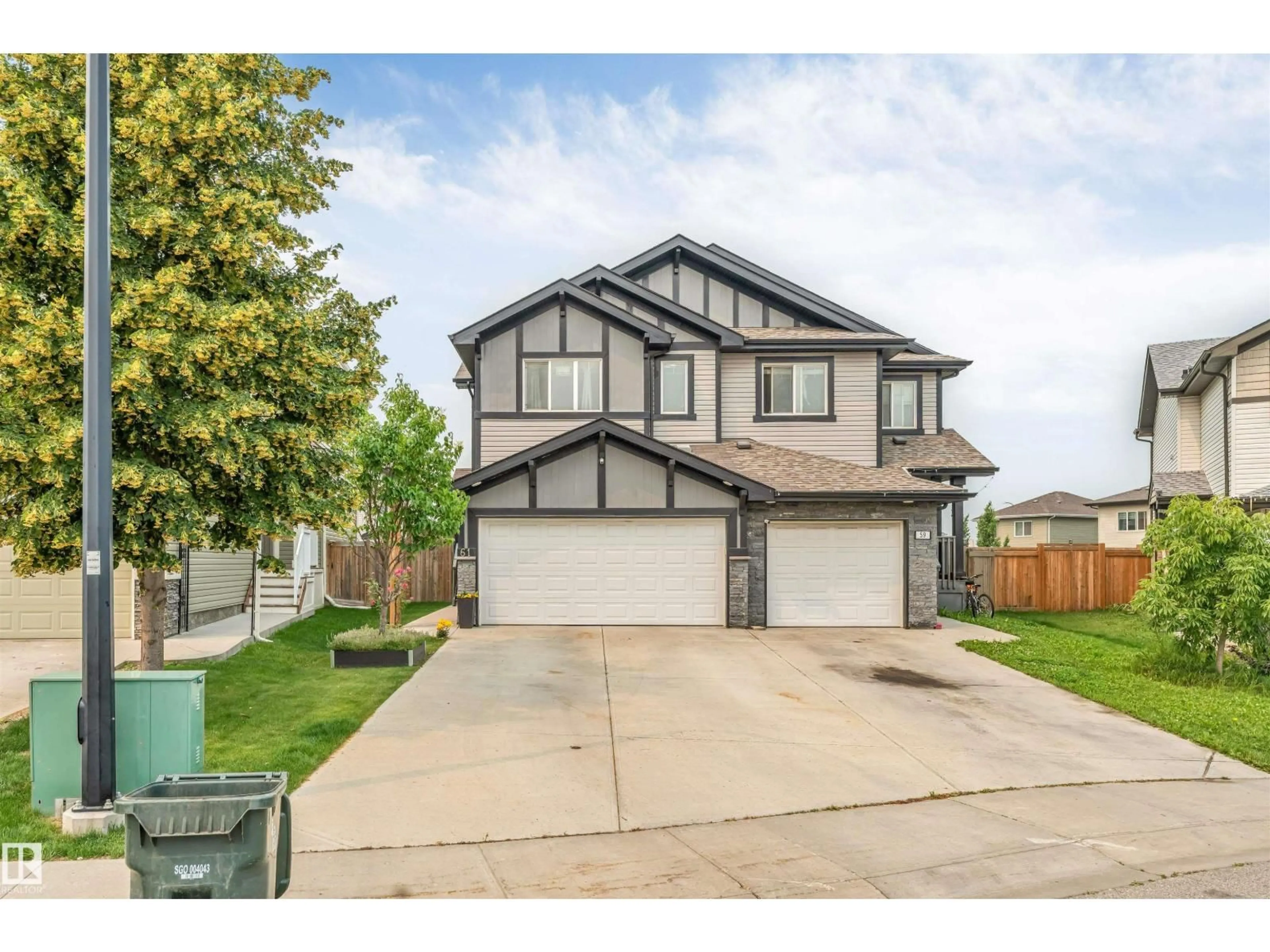 Home with vinyl exterior material, street for 61 SPRINGWOOD WY, Spruce Grove Alberta T7X0L4