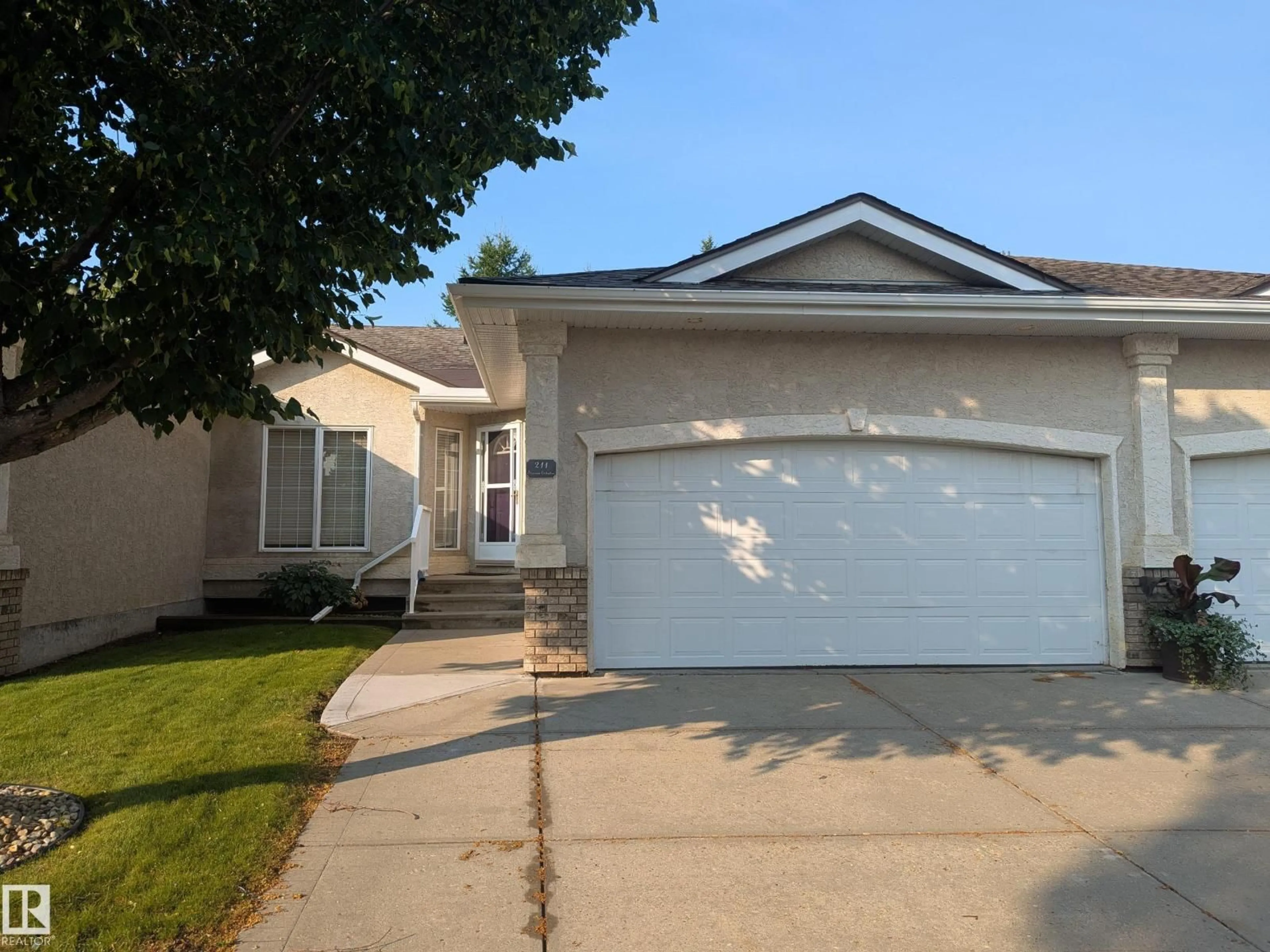 Home with vinyl exterior material, street for 211 YOUVILLE DR, Edmonton Alberta T6L7E7
