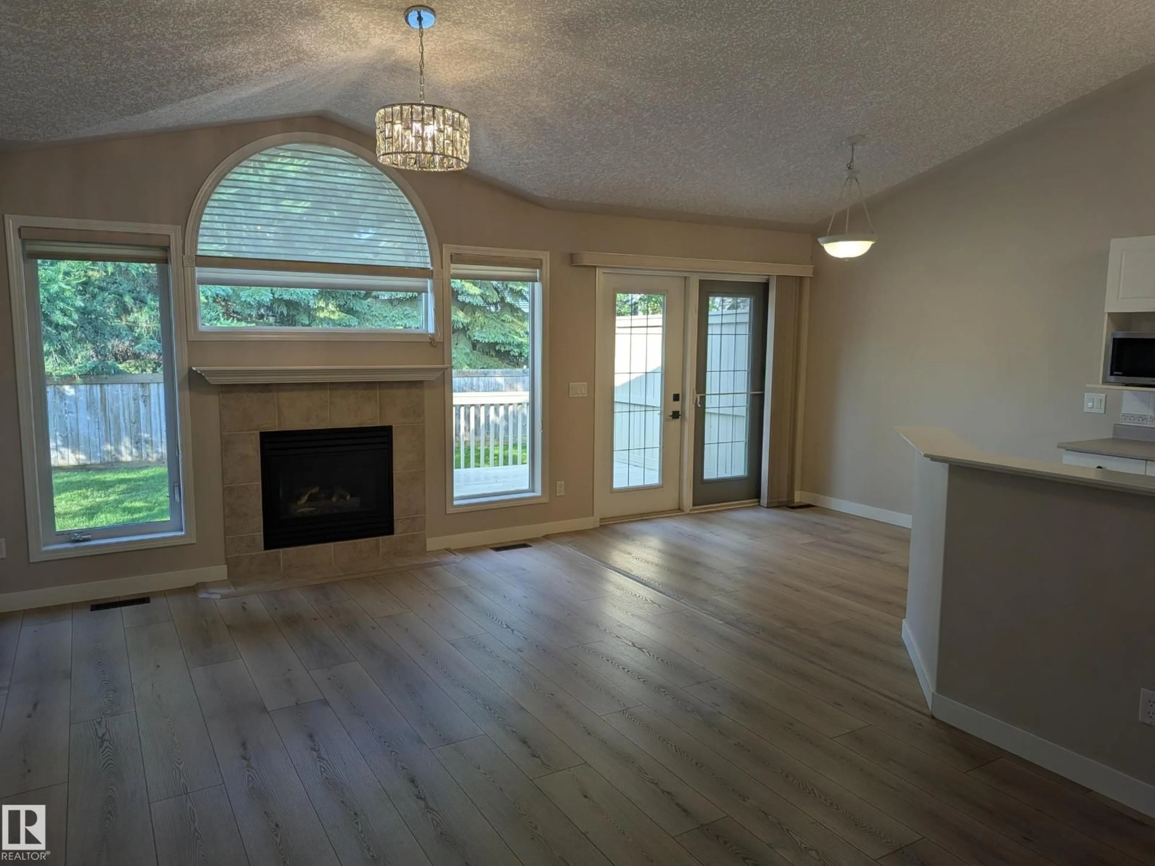 Living room with furniture, wood/laminate floor for 211 YOUVILLE DR, Edmonton Alberta T6L7E7