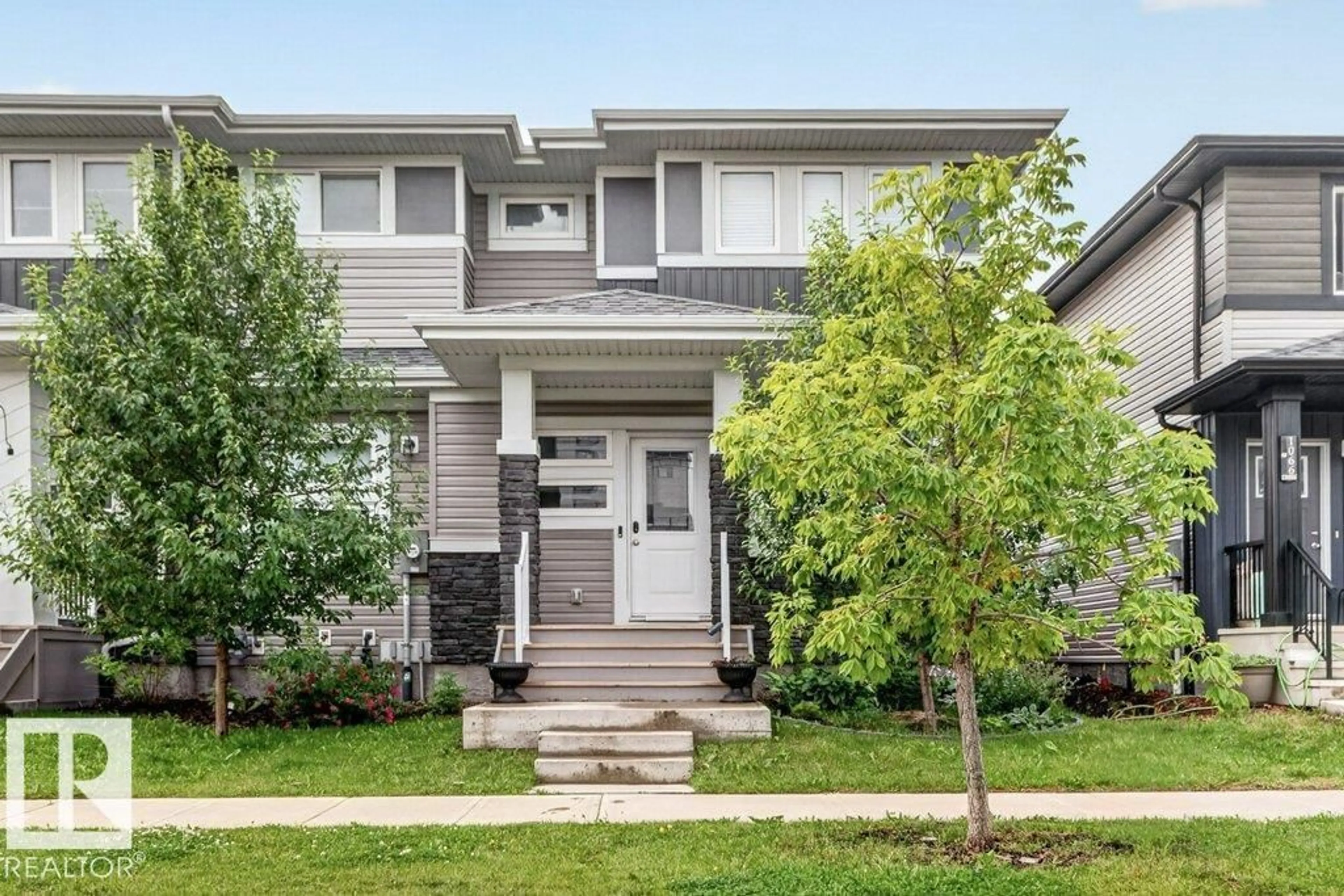 Home with vinyl exterior material, street for 1064 CY BECKER RD, Edmonton Alberta T5Z0J1