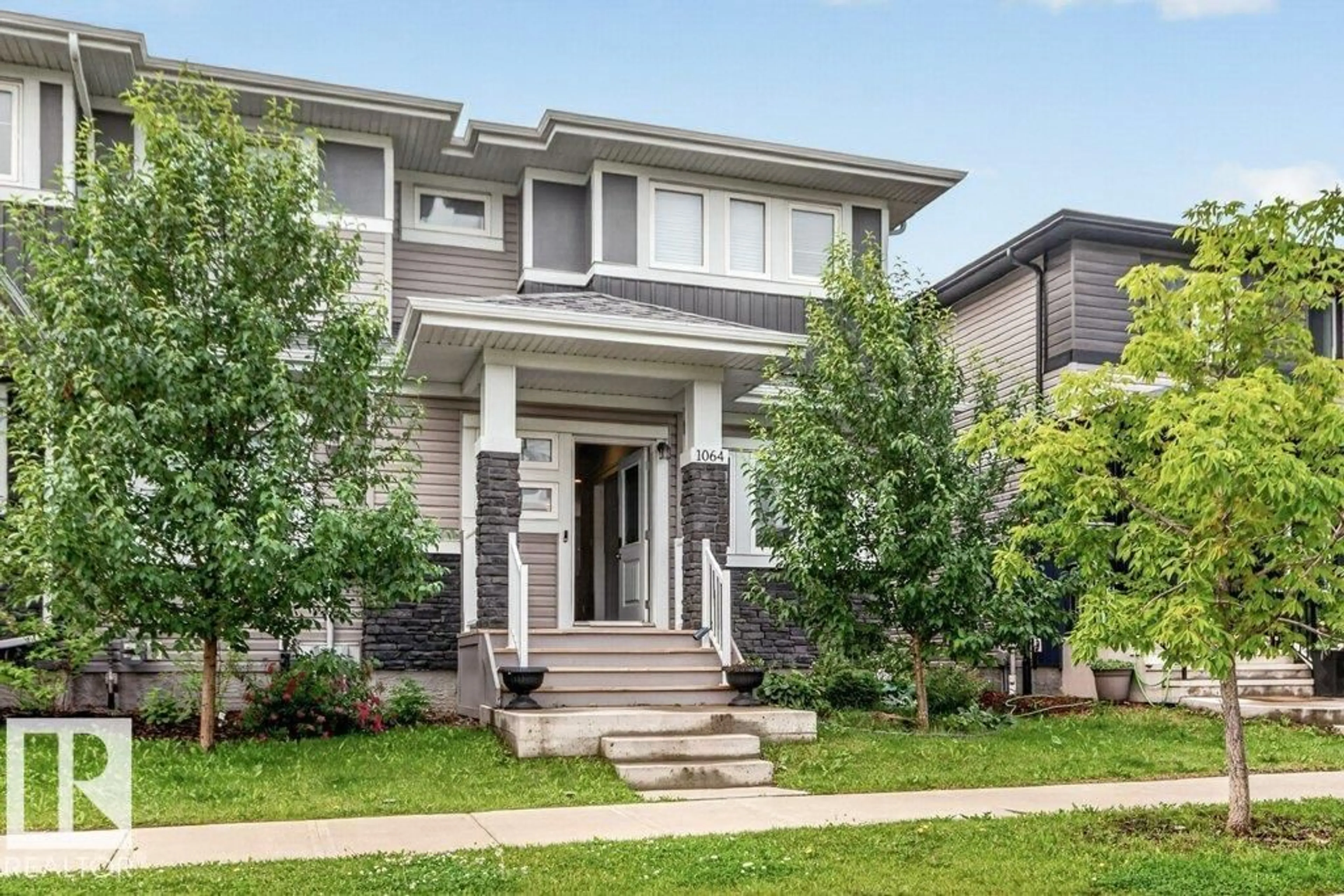 Home with brick exterior material, street for 1064 CY BECKER RD, Edmonton Alberta T5Z0J1