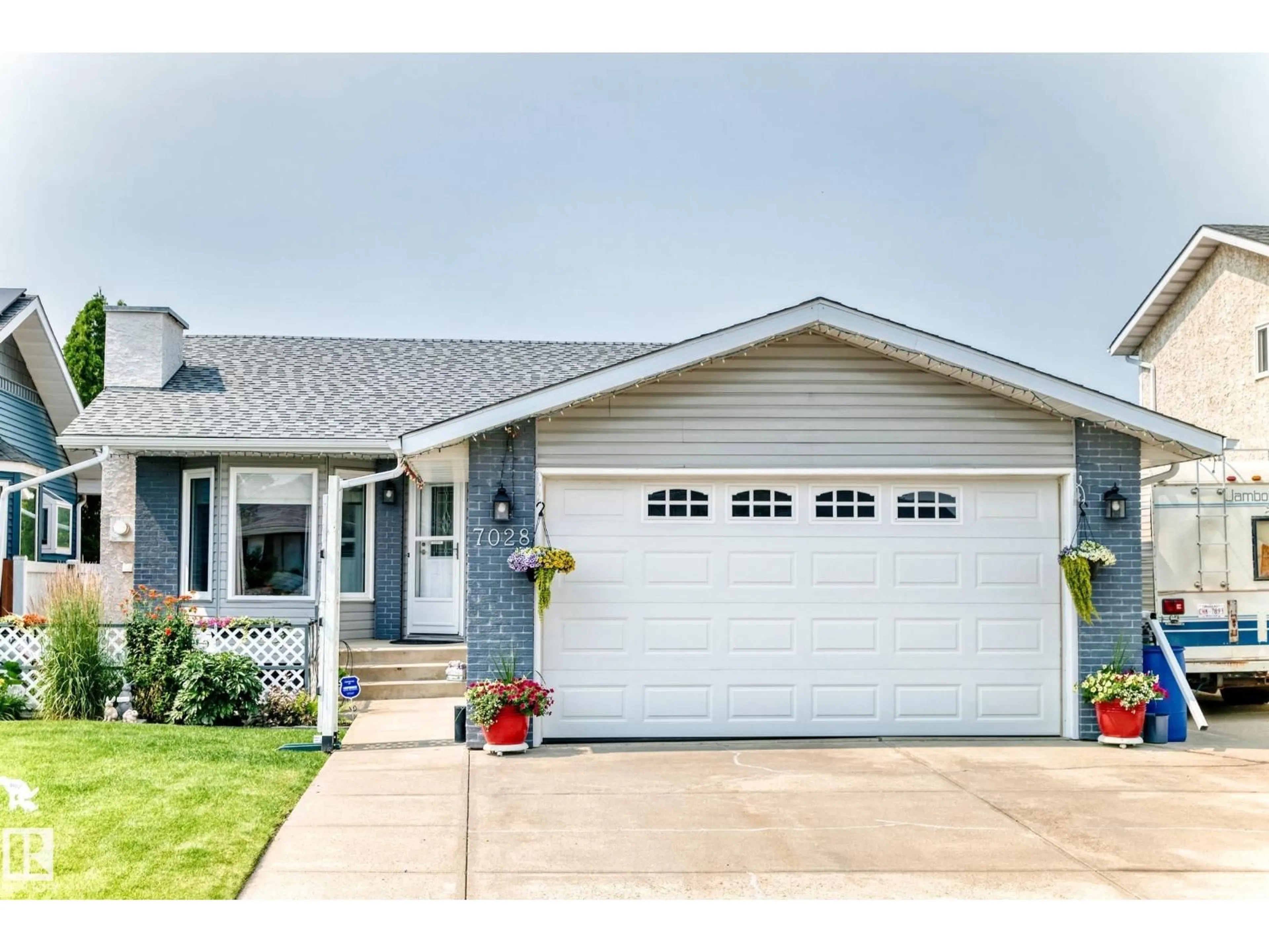 Home with vinyl exterior material, street for NW - 7028 190 ST, Edmonton Alberta T5T5E5