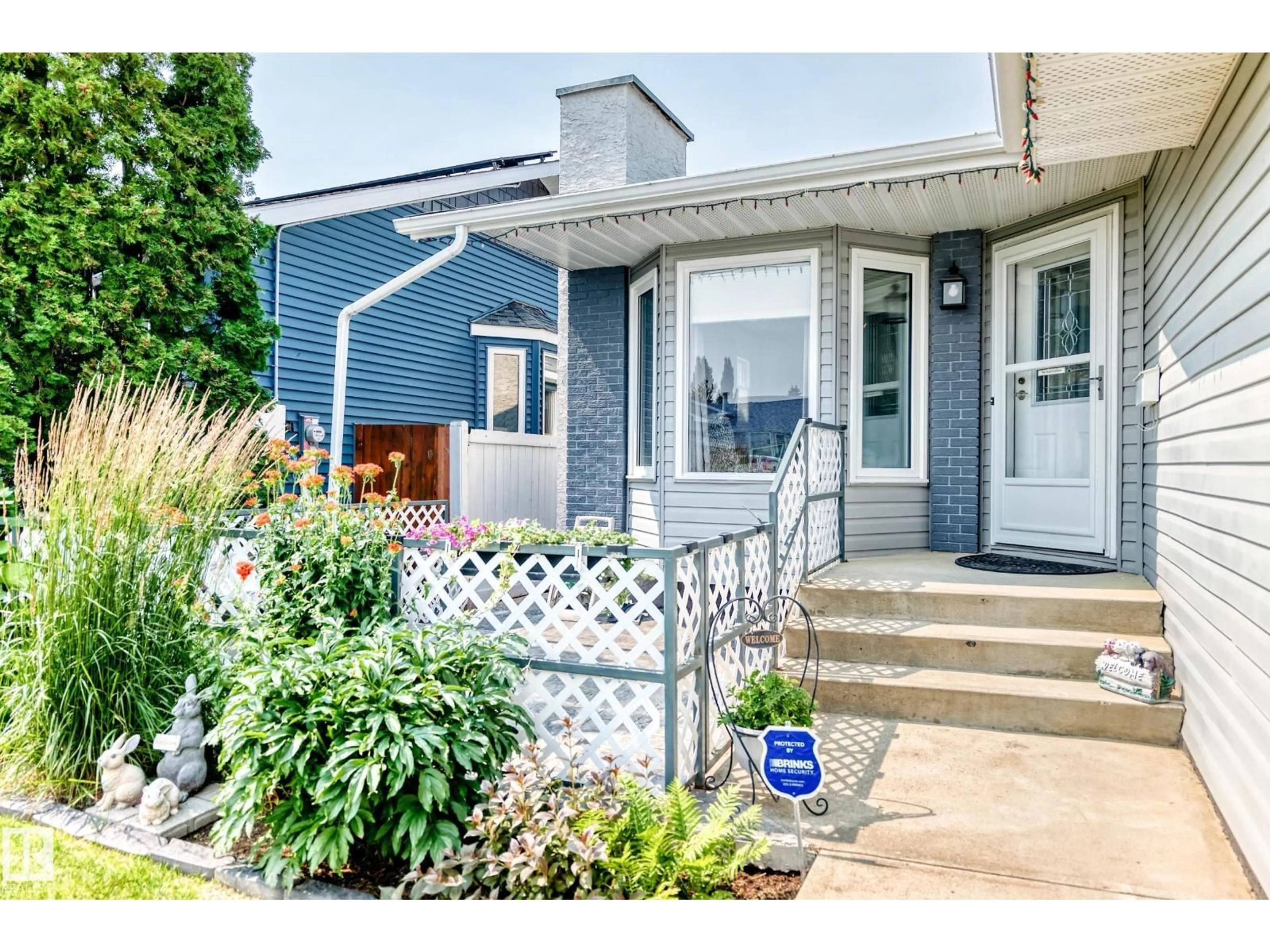 Home with vinyl exterior material, street for NW - 7028 190 ST, Edmonton Alberta T5T5E5