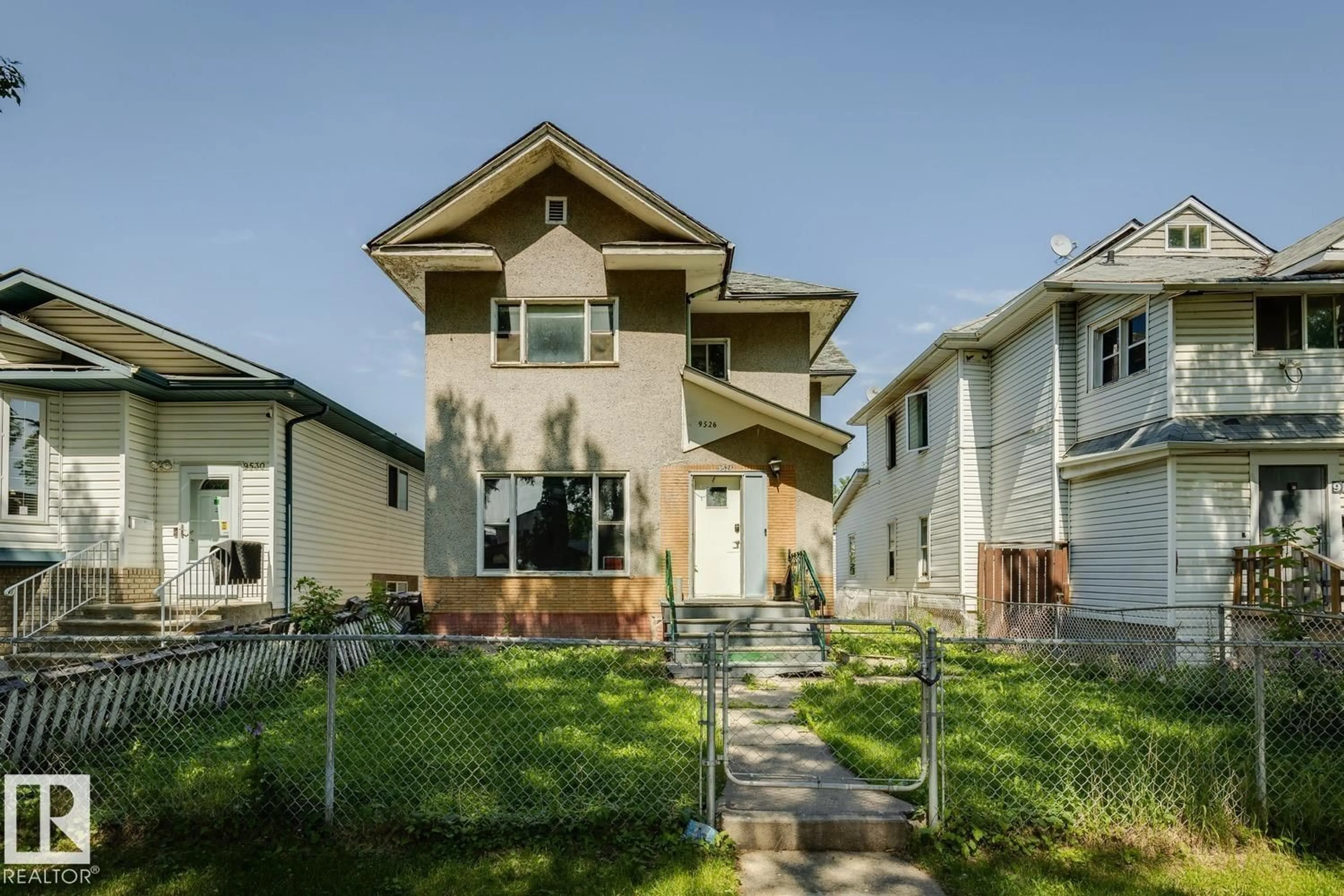 Home with vinyl exterior material, street for 9526 106A AV NW, Edmonton Alberta T5H0S8