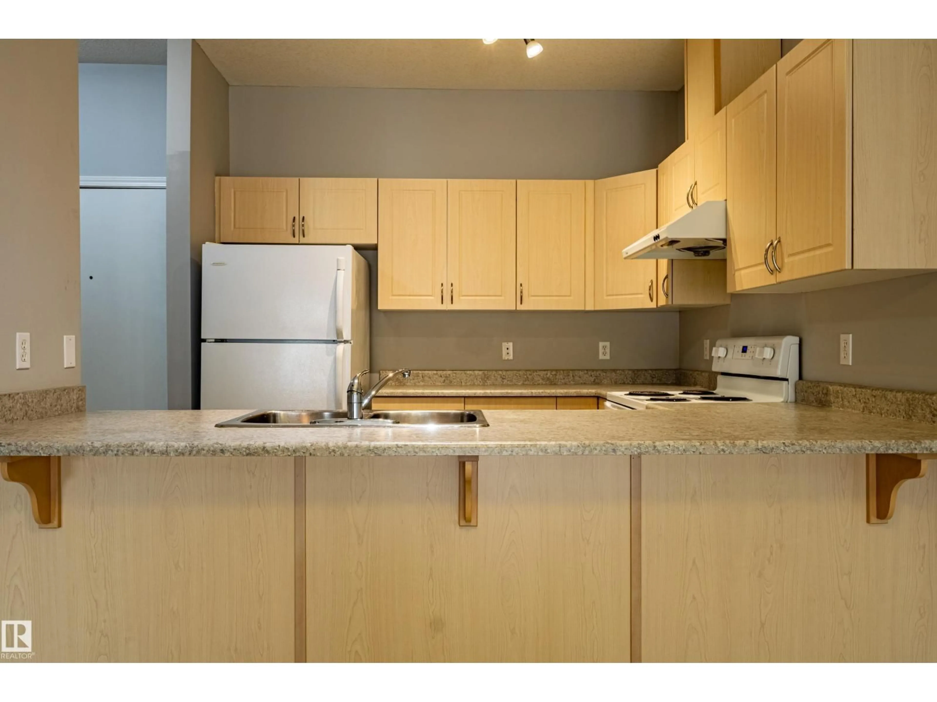 Standard kitchen, wood/laminate floor for #412 - 4304 139 AV, Edmonton Alberta T5Y0H6