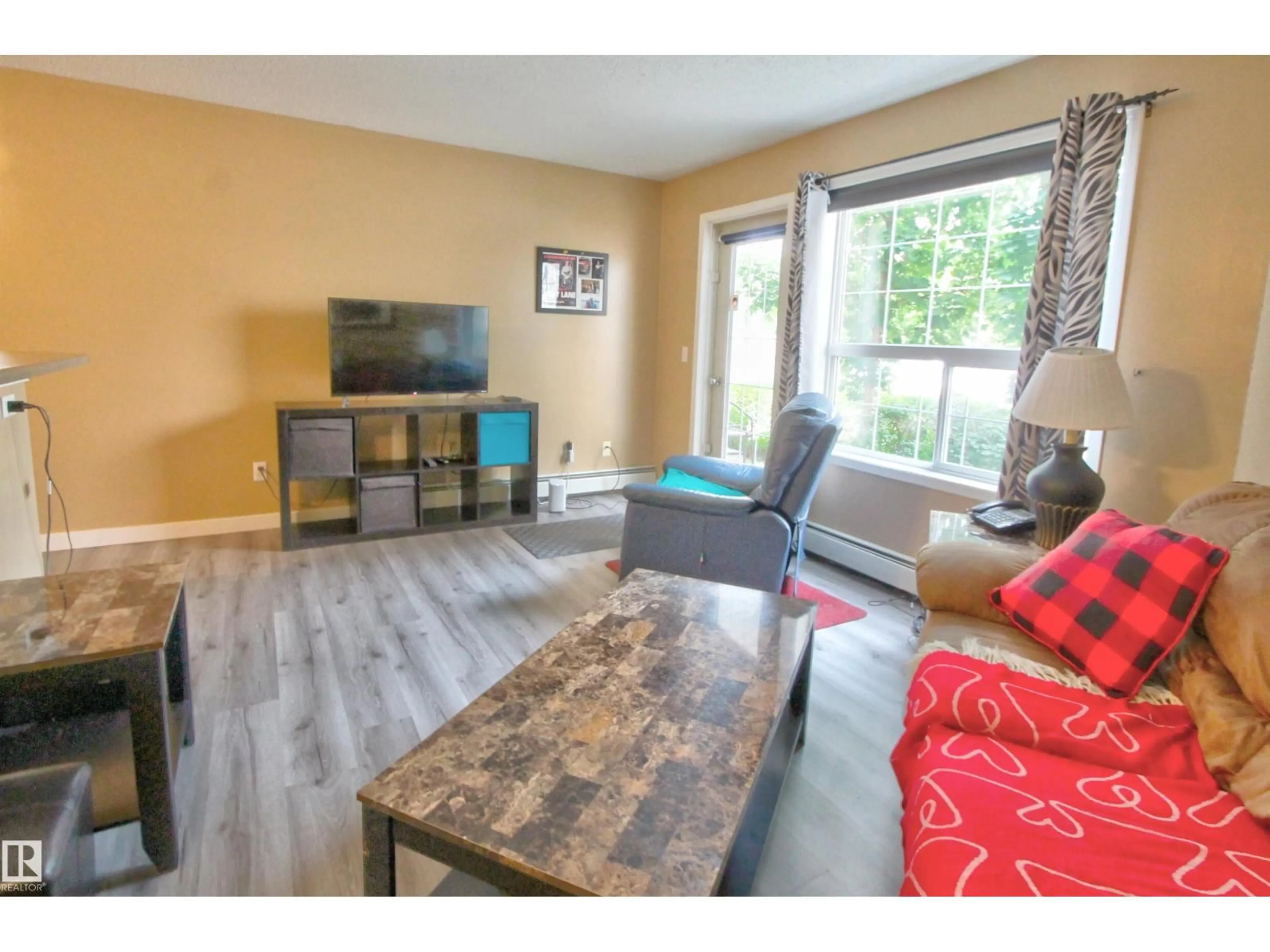Living room with furniture, wood/laminate floor for #106 - 106 ALPINE BV, St. Albert Alberta T8N3Y3