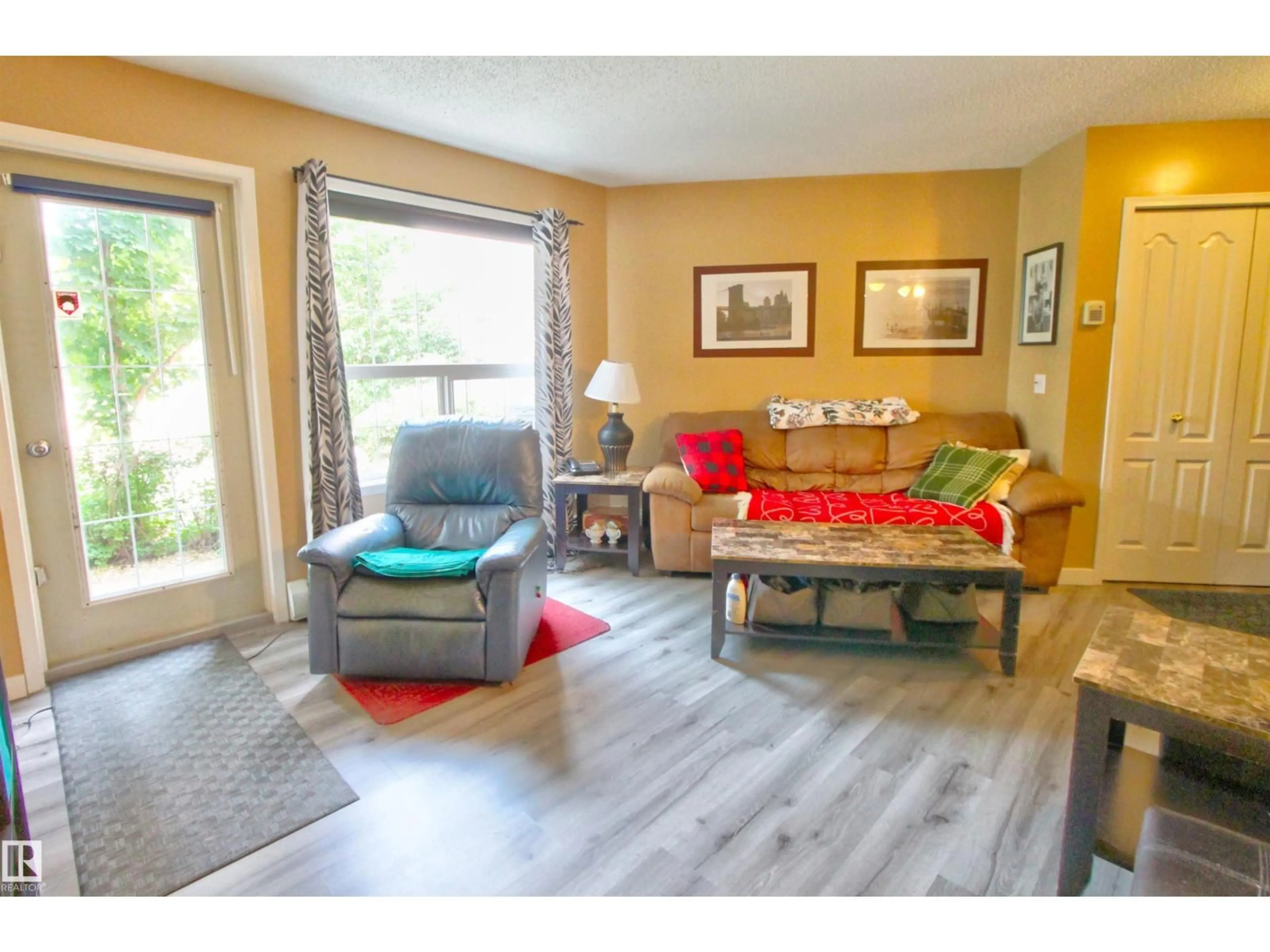 Living room with furniture, wood/laminate floor for #106 - 106 ALPINE BV, St. Albert Alberta T8N3Y3