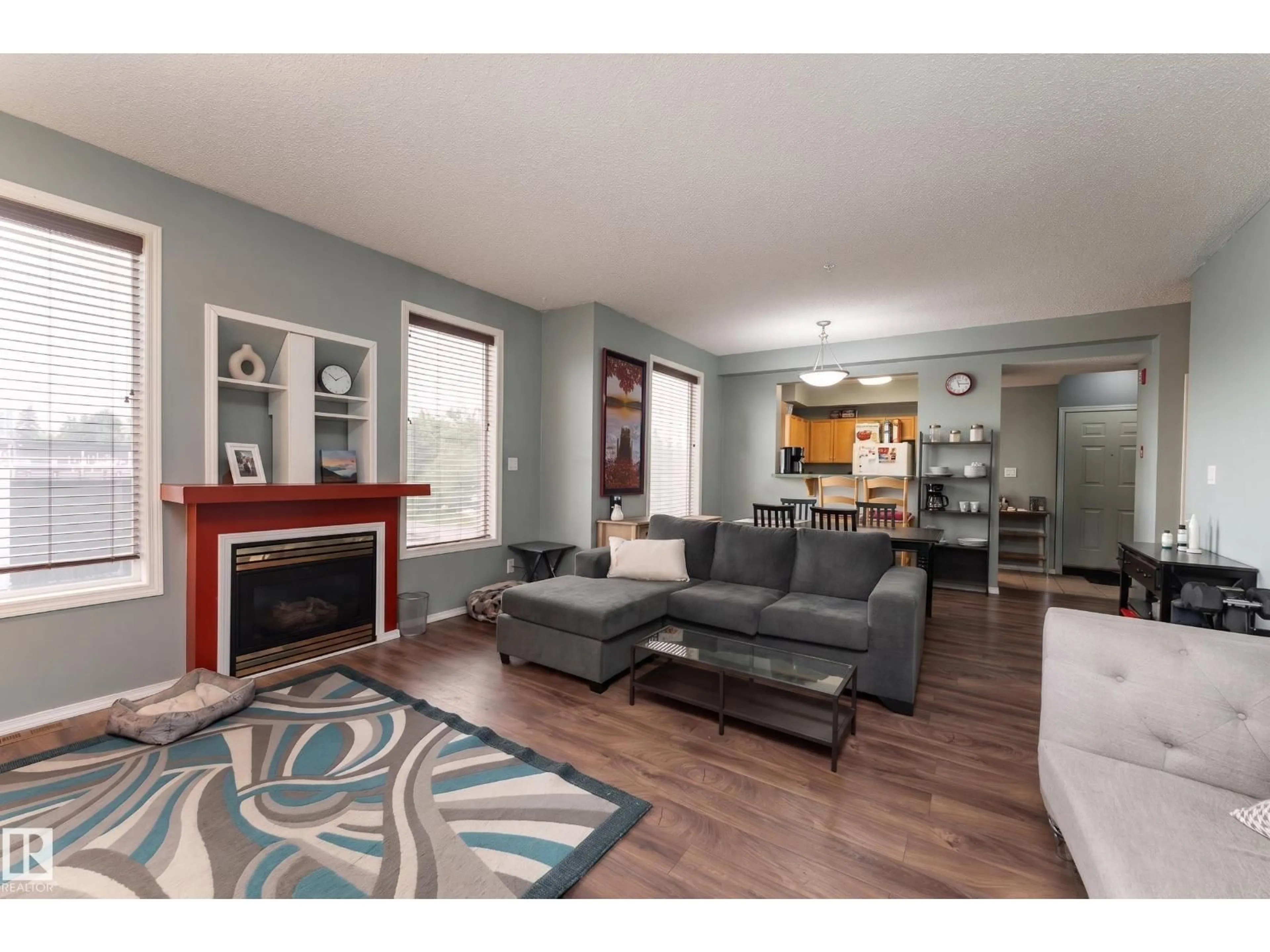 Living room with furniture, wood/laminate floor for 301 - 8108 109 ST NW, Edmonton Alberta T6G2V7