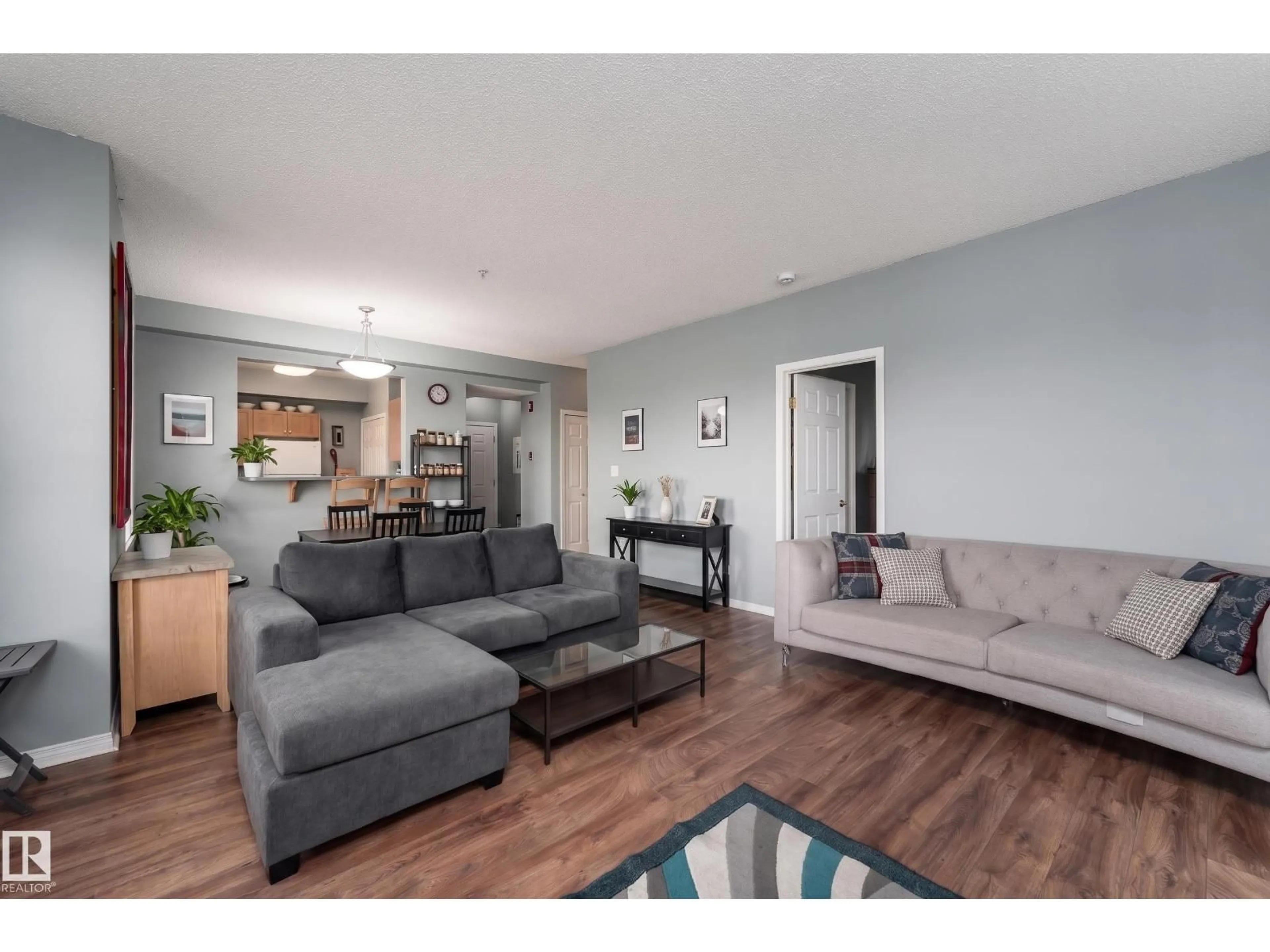 Living room with furniture, wood/laminate floor for 301 - 8108 109 ST NW, Edmonton Alberta T6G2V7