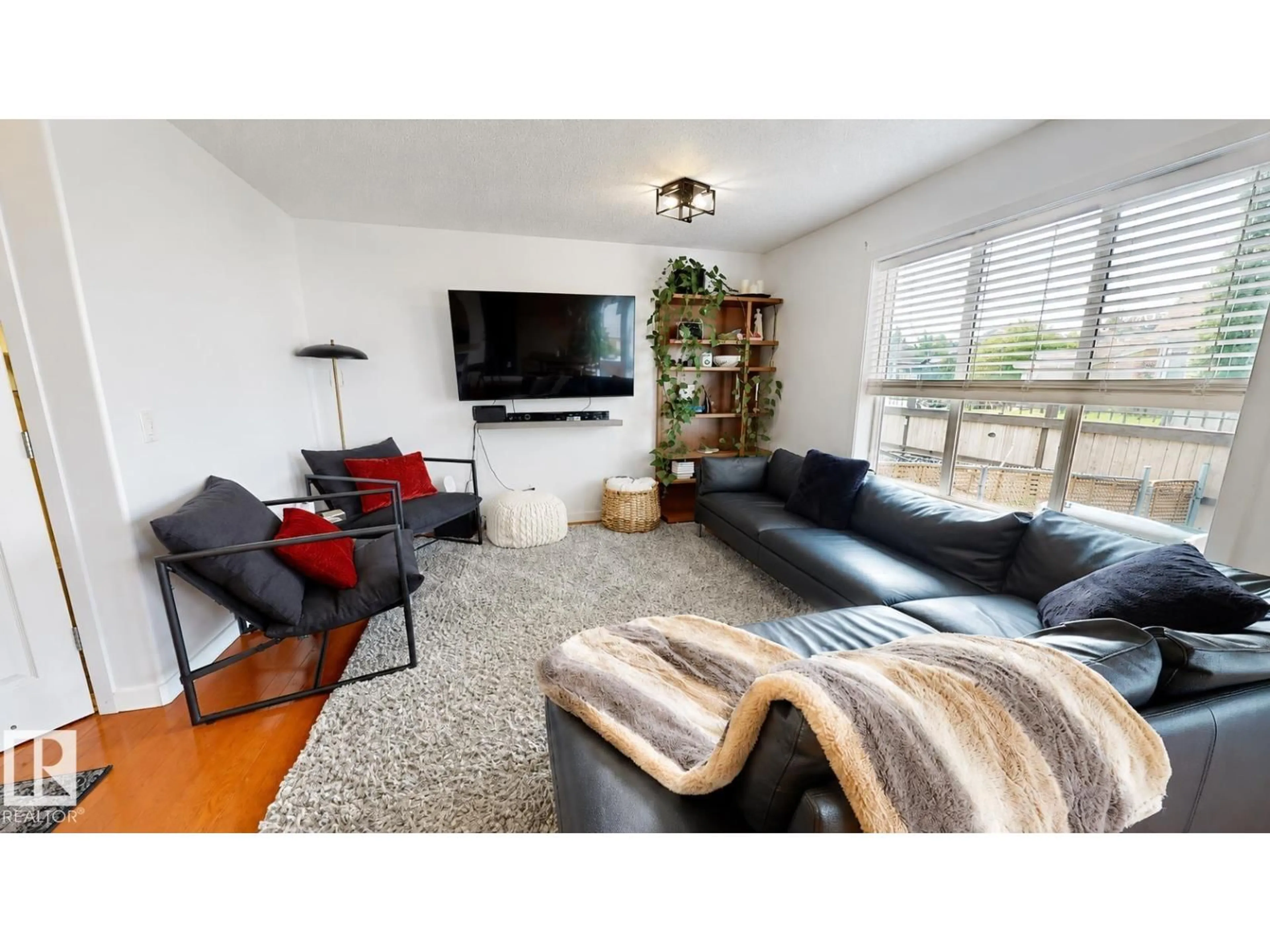 Living room with furniture, wood/laminate floor for 155 - 80 CROCUS CR, Sherwood Park Alberta T8H2M4