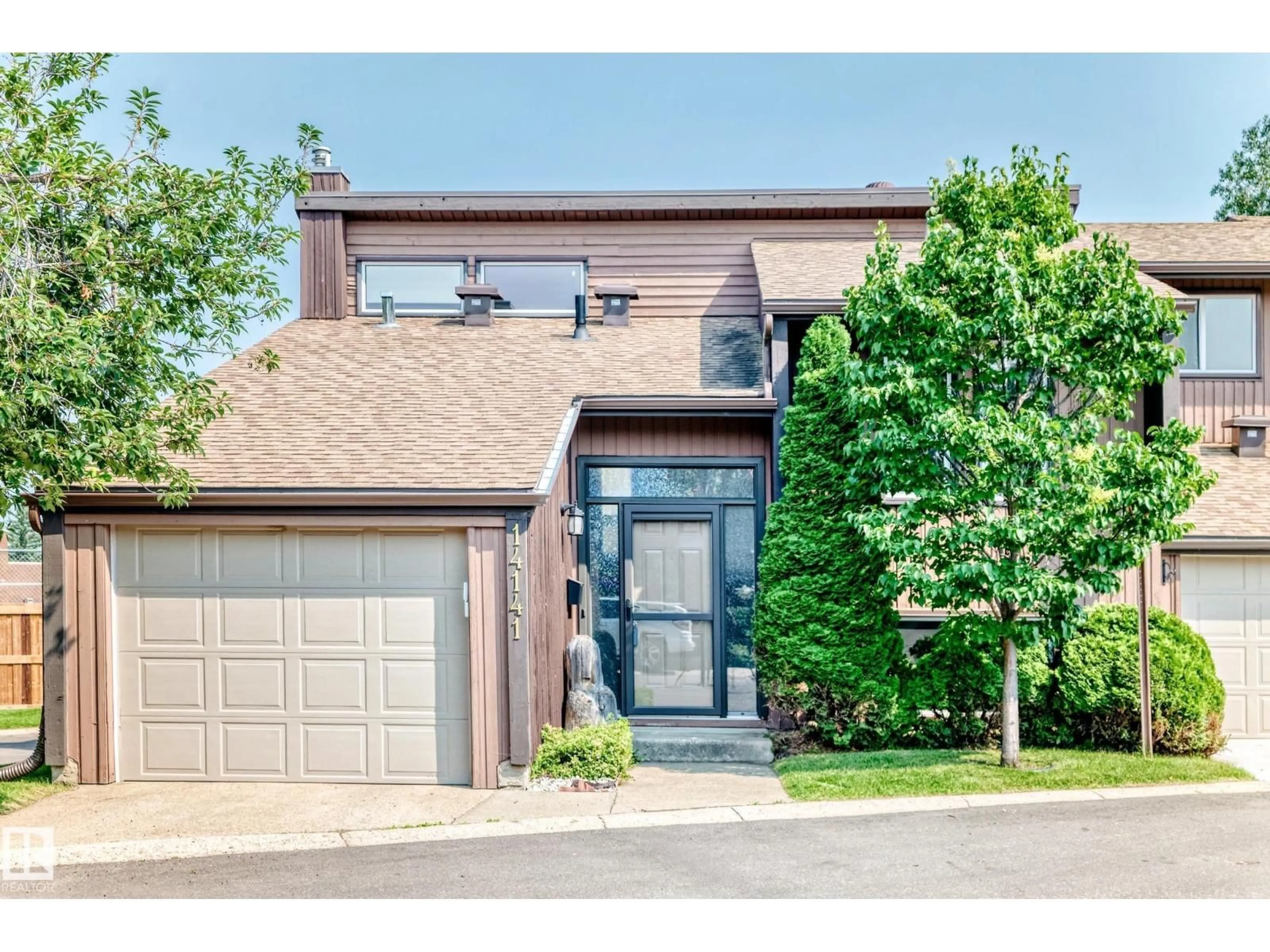 Home with brick exterior material, street for 14141 26 ST, Edmonton Alberta T5Y1Y4