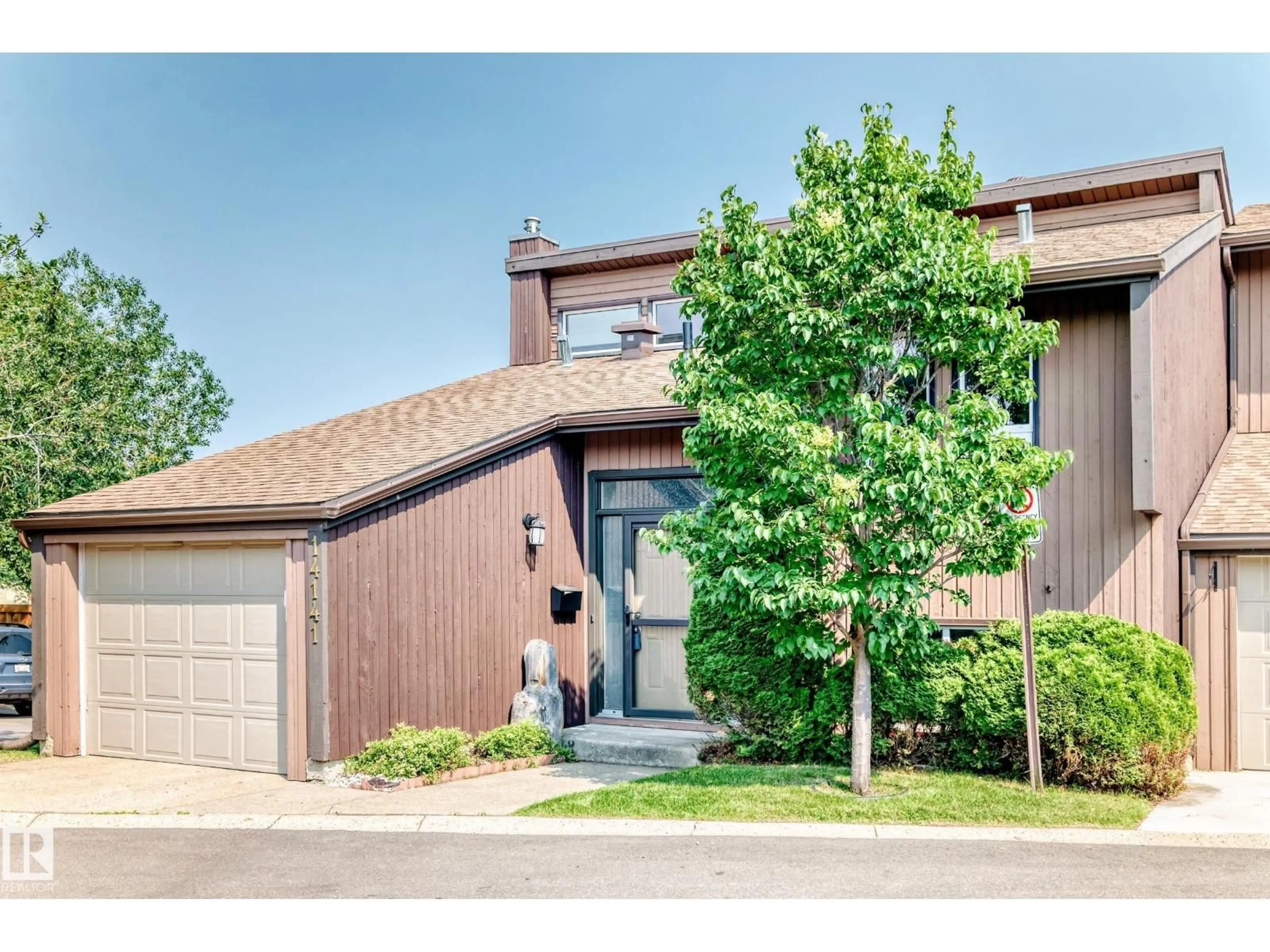 Home with brick exterior material, street for 14141 26 ST, Edmonton Alberta T5Y1Y4