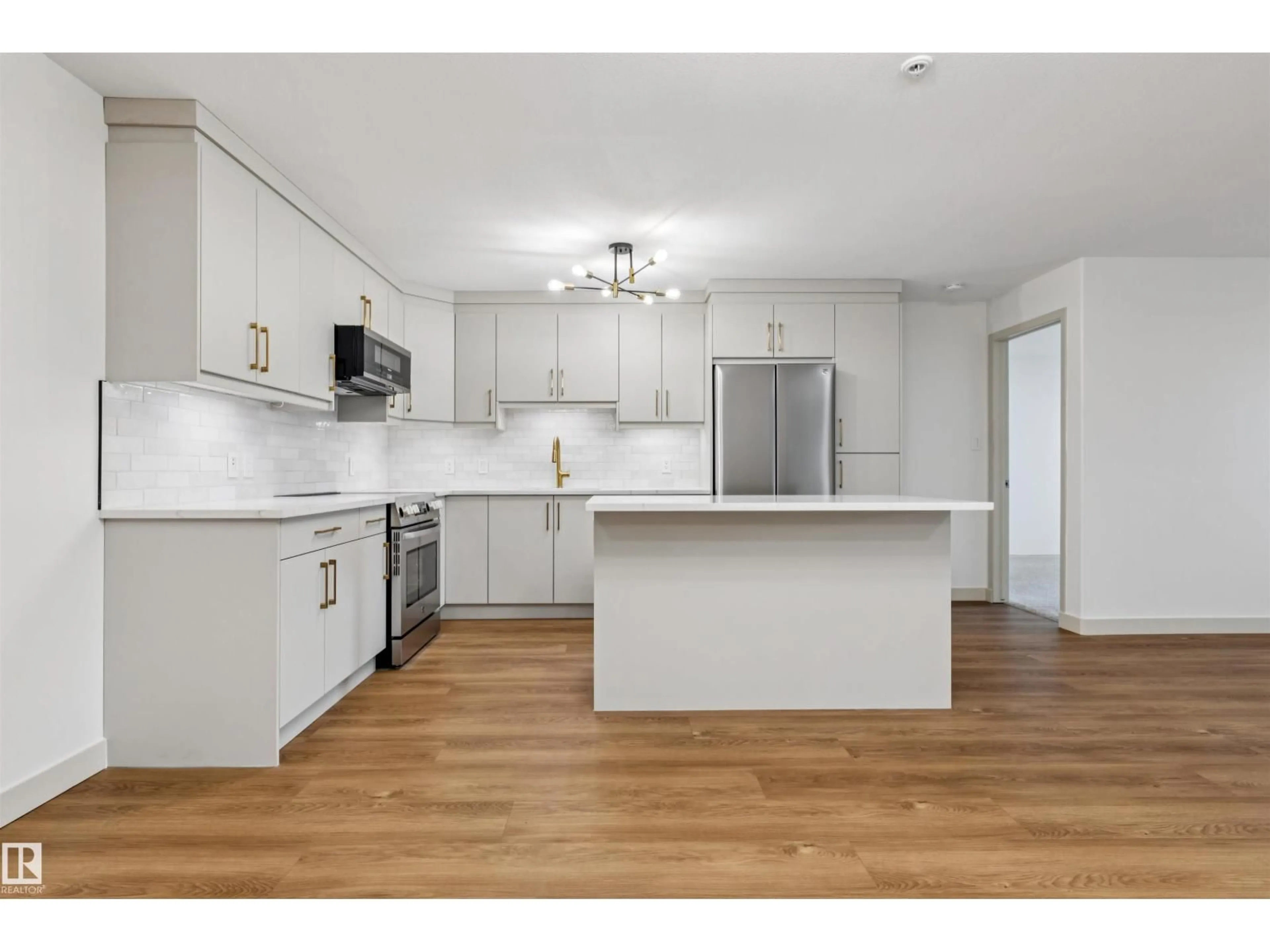 Open concept kitchen, wood/laminate floor for #353 - 2096 BLACKMUD CREEK DR, Edmonton Alberta T6W0G1