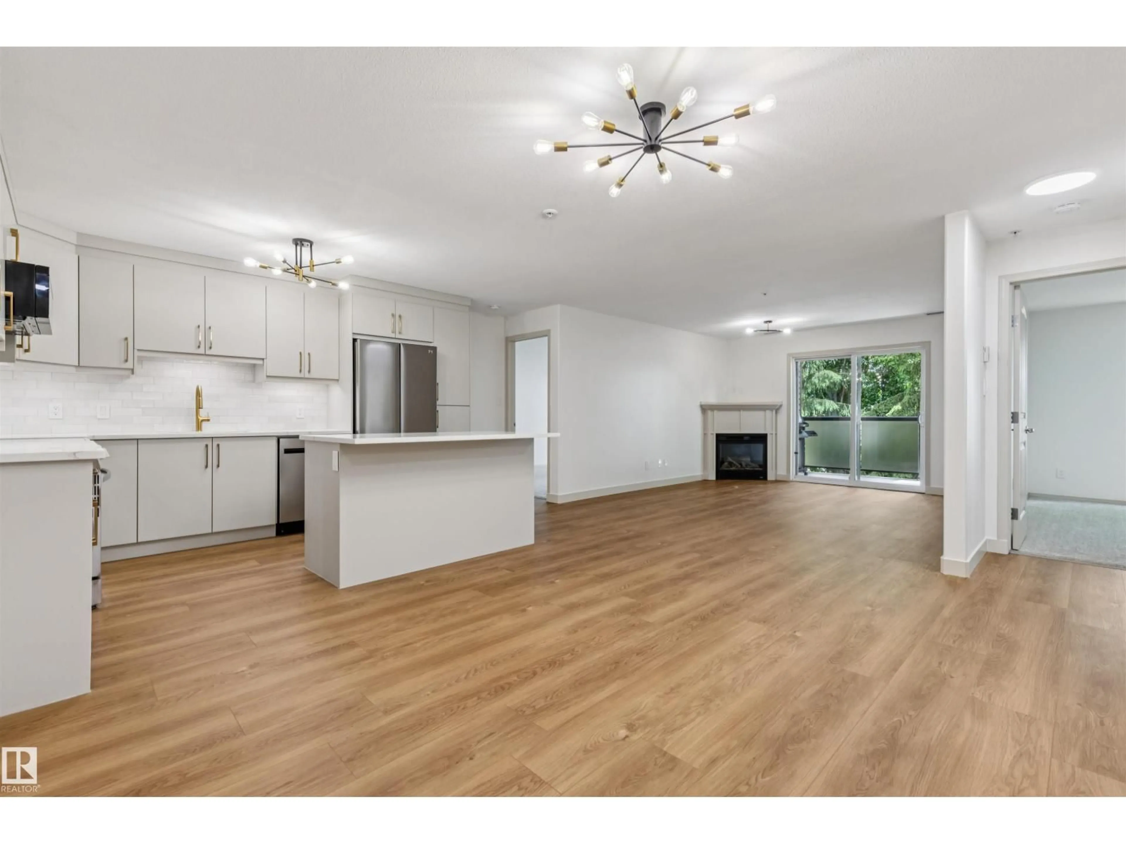 Open concept kitchen, wood/laminate floor for #353 - 2096 BLACKMUD CREEK DR, Edmonton Alberta T6W0G1