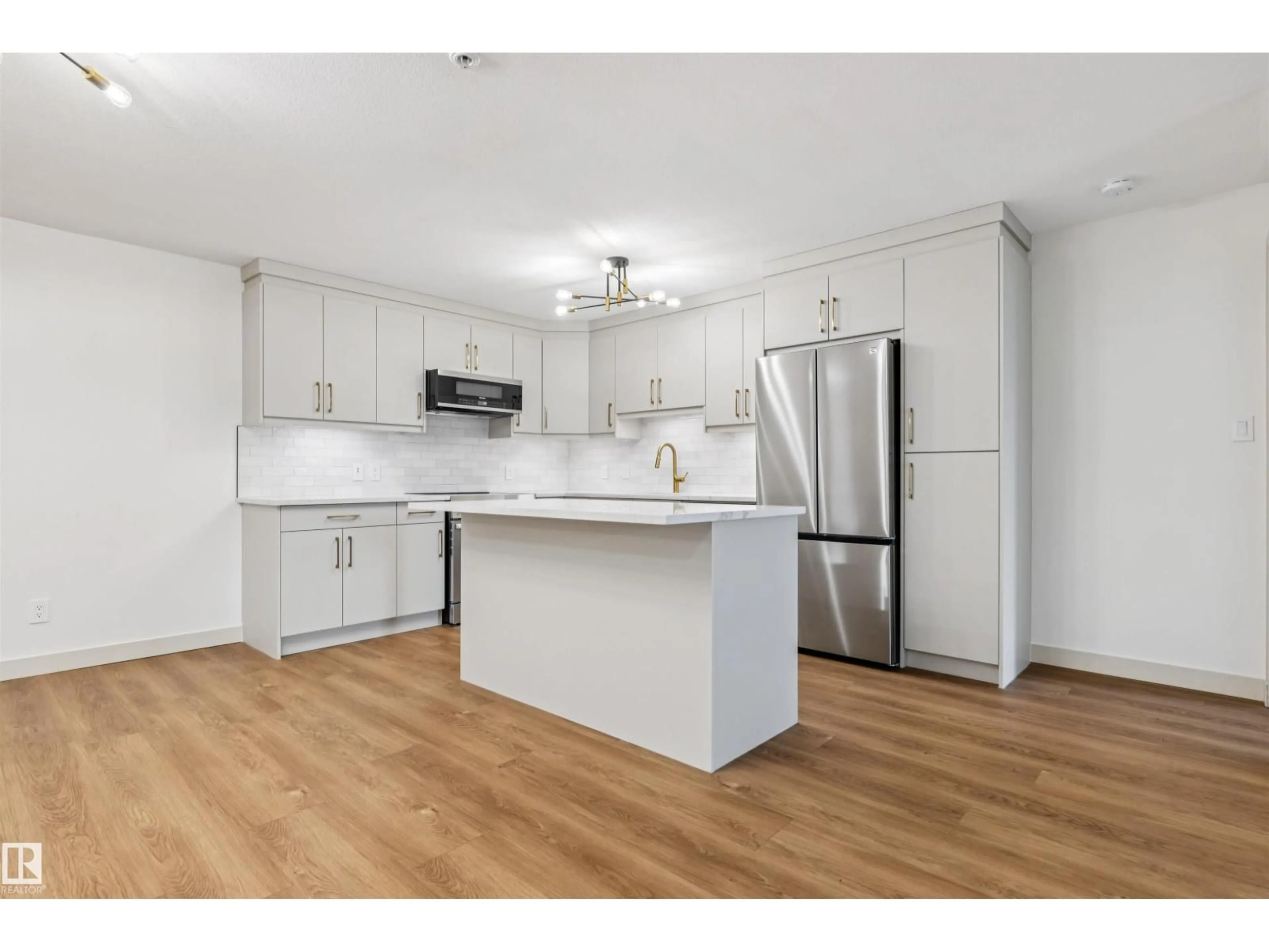 Open concept kitchen, wood/laminate floor for #353 - 2096 BLACKMUD CREEK DR, Edmonton Alberta T6W0G1
