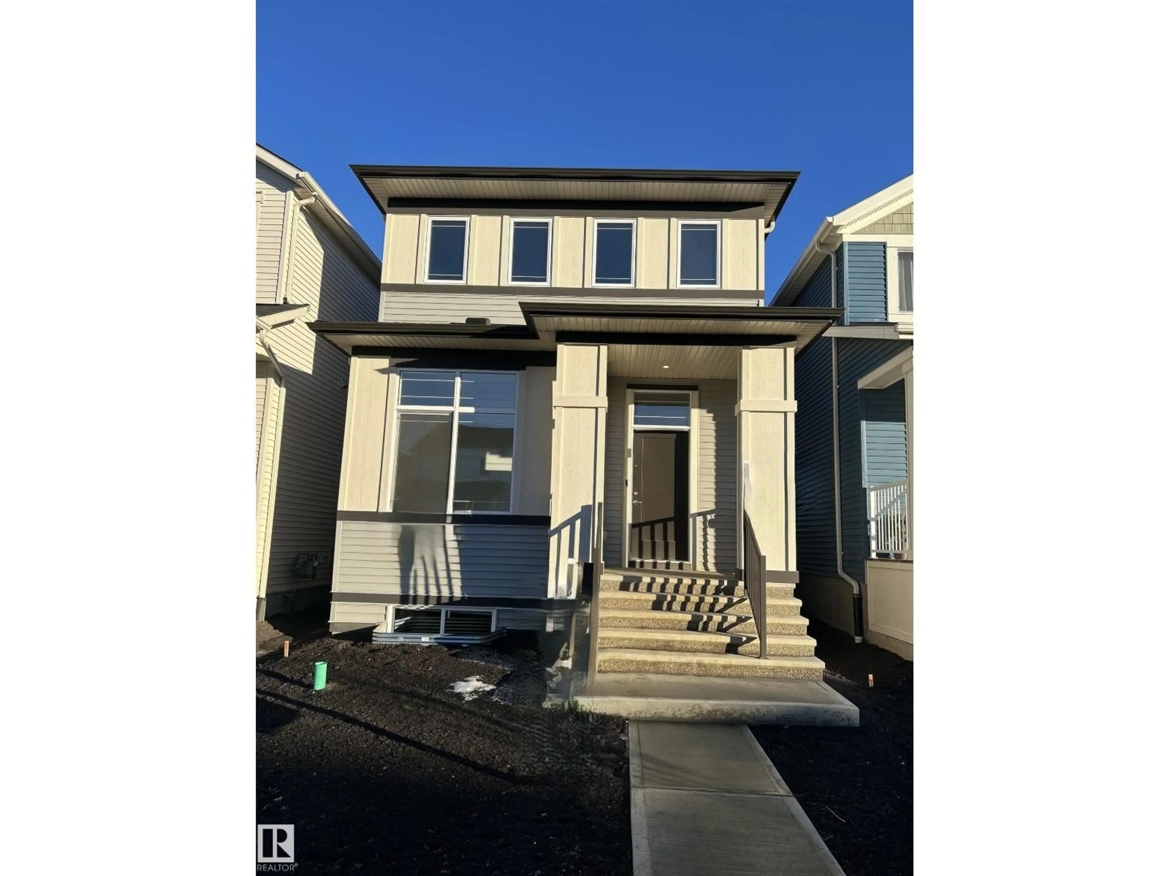 Home with vinyl exterior material, street for 5115 PARC REUNIS WY, Beaumont Alberta T4X3E6