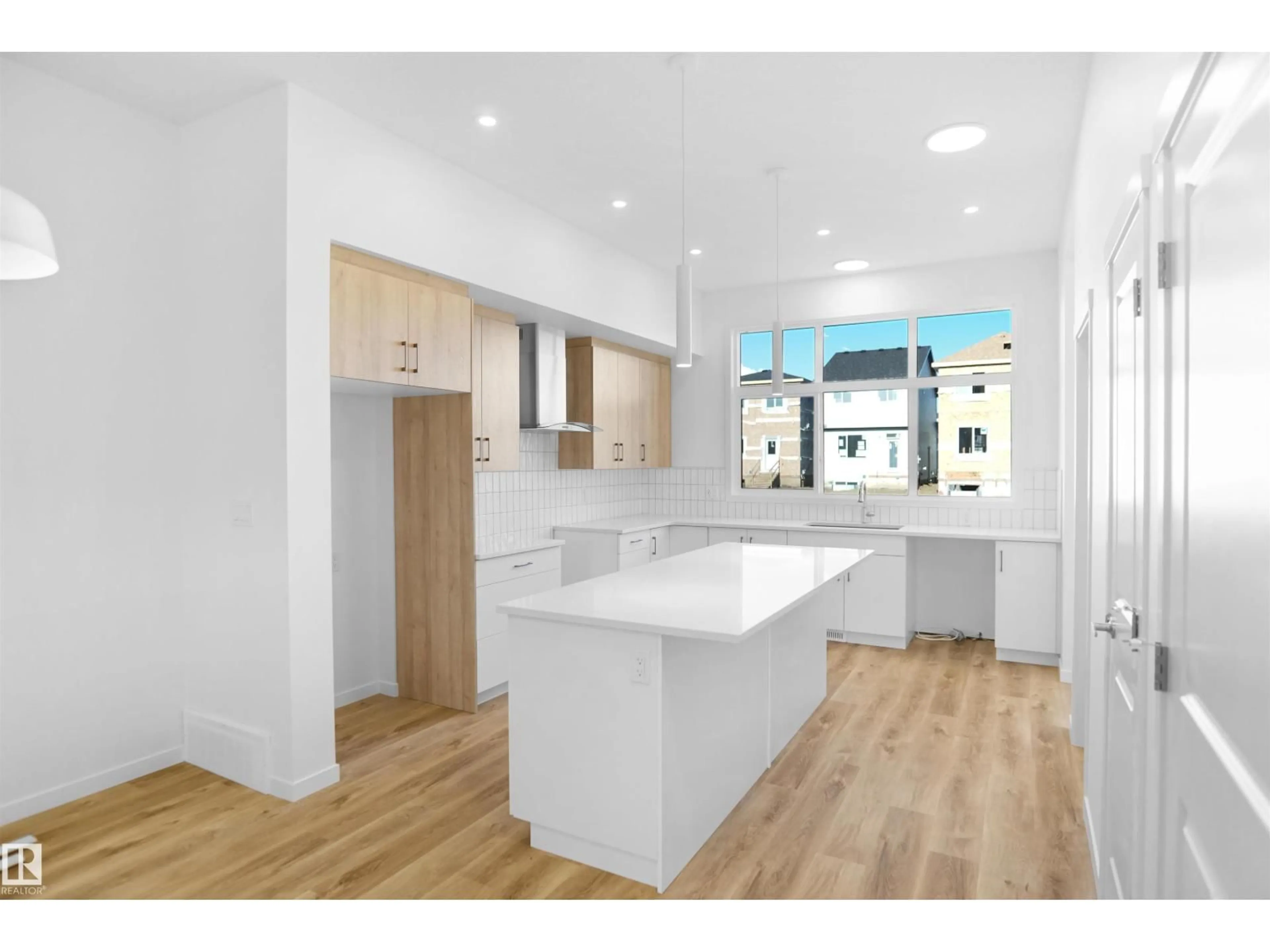 Open concept kitchen, wood/laminate floor for 5115 PARC REUNIS WY, Beaumont Alberta T4X3E6