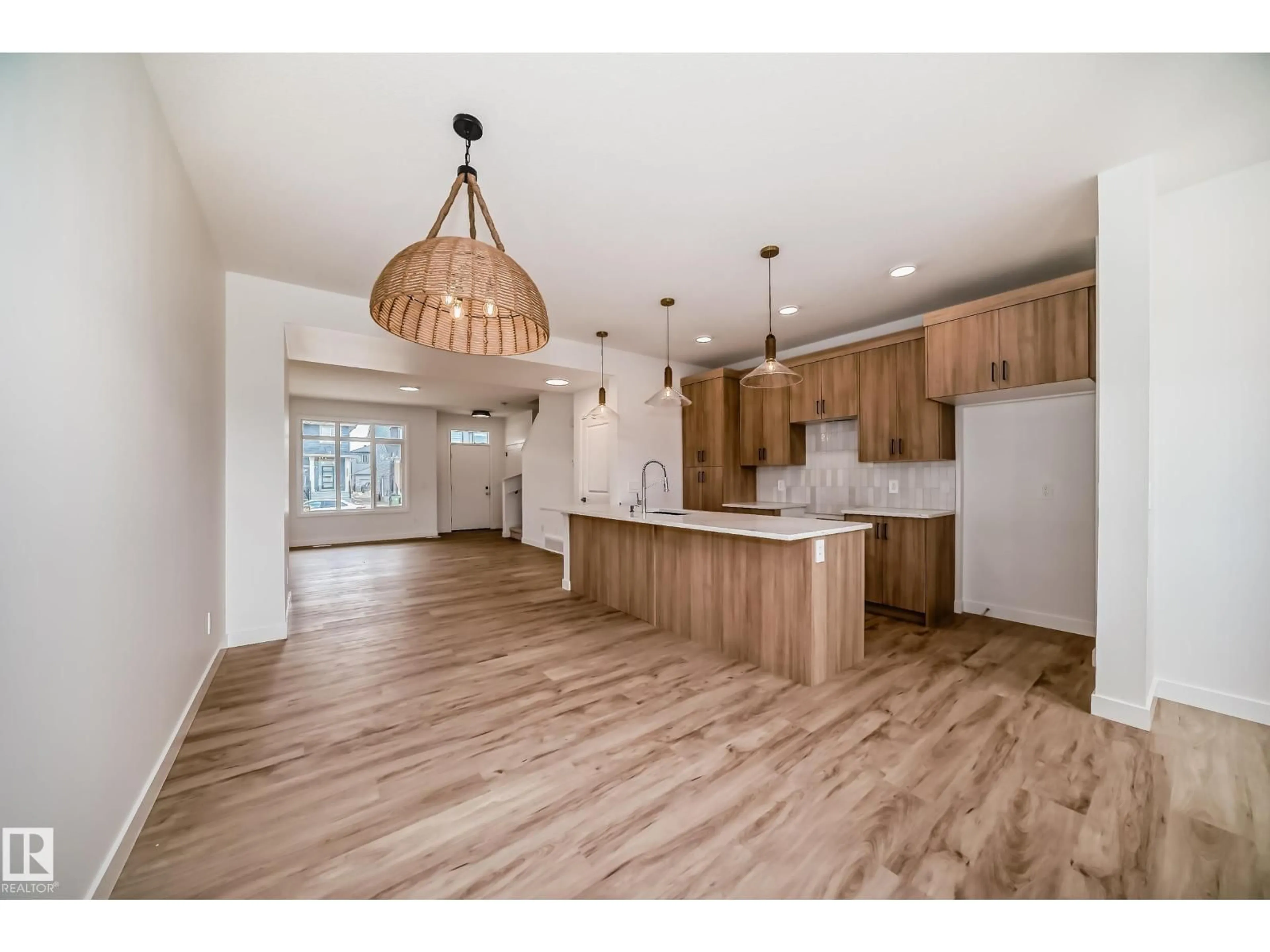 Open concept kitchen, wood/laminate floor for SW - 2624 62 ST, Edmonton Alberta T6X3G3