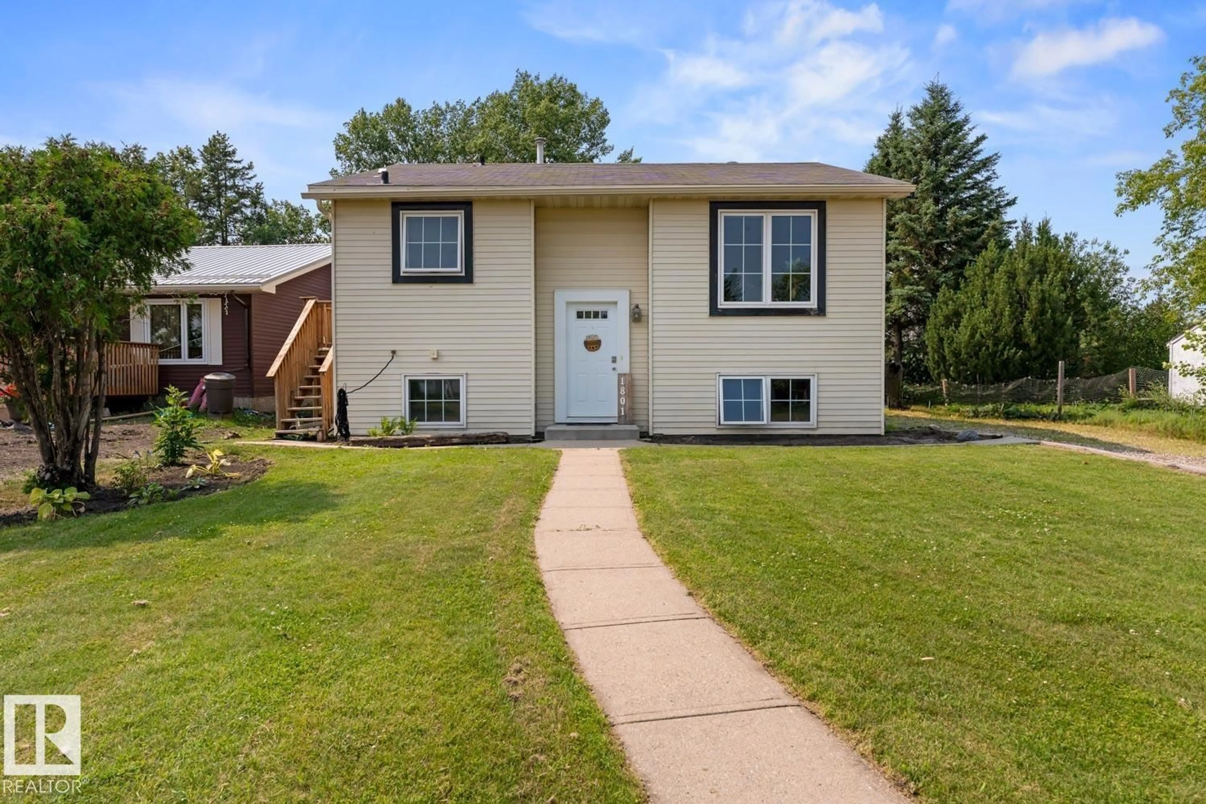 Home with vinyl exterior material, street for 1801 FOREST DR, Cold Lake Alberta T9M1L7