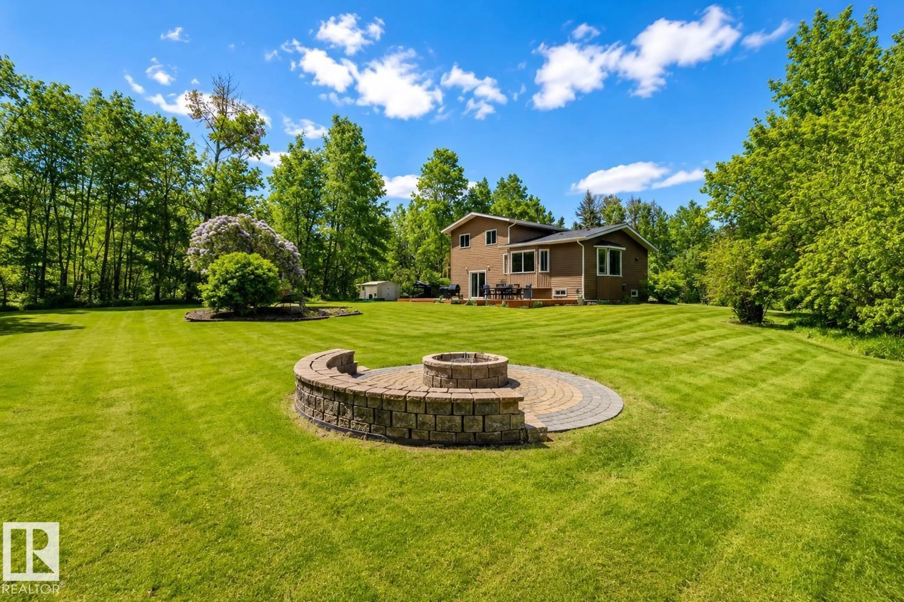 A pic from outside/outdoor area/front of a property/back of a property/a pic from drone, unknown for 100 22549 TWP RD, Rural Leduc County Alberta T0B3M1