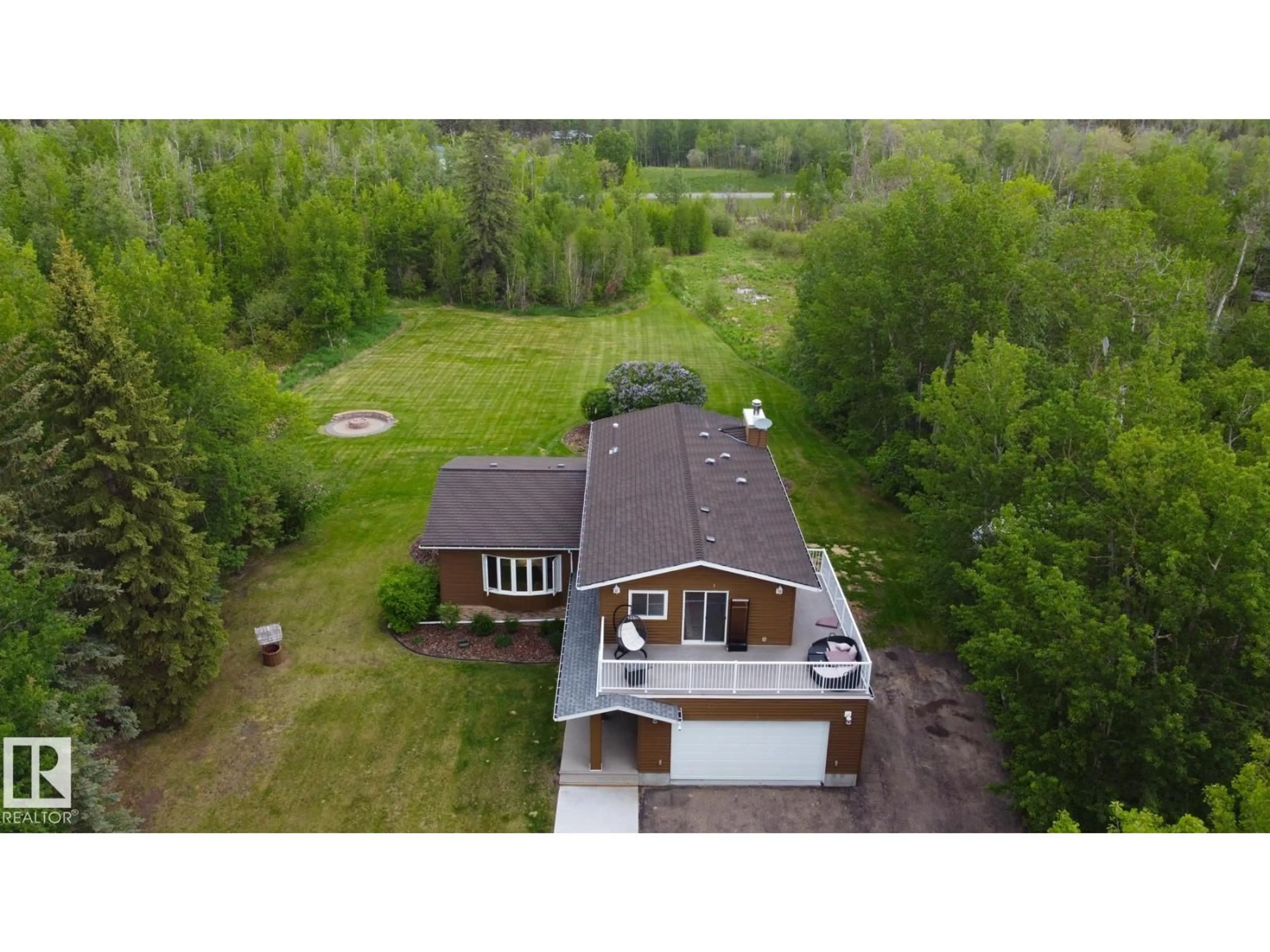 A pic from outside/outdoor area/front of a property/back of a property/a pic from drone, unknown for 100 22549 TWP RD, Rural Leduc County Alberta T8C1H1