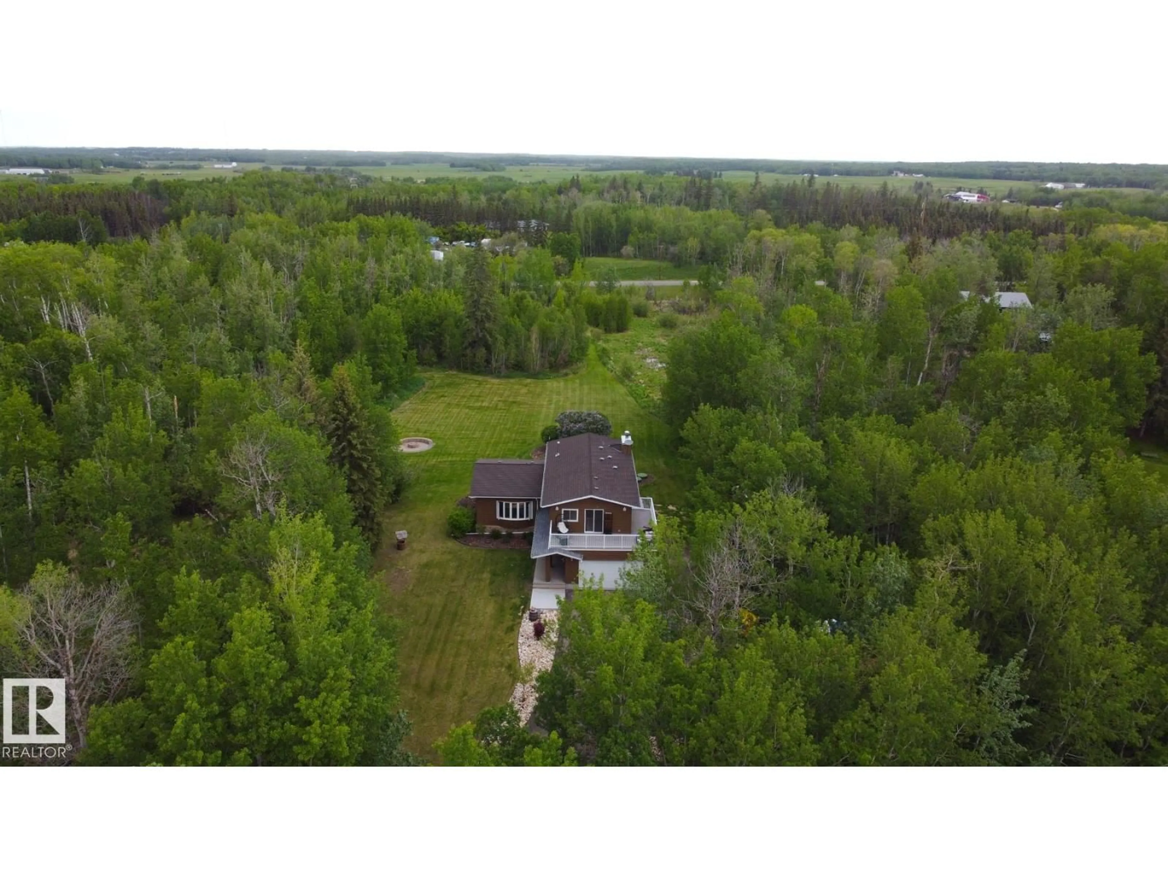 A pic from outside/outdoor area/front of a property/back of a property/a pic from drone, unknown for 100 22549 TWP RD, Rural Leduc County Alberta T8C1H1