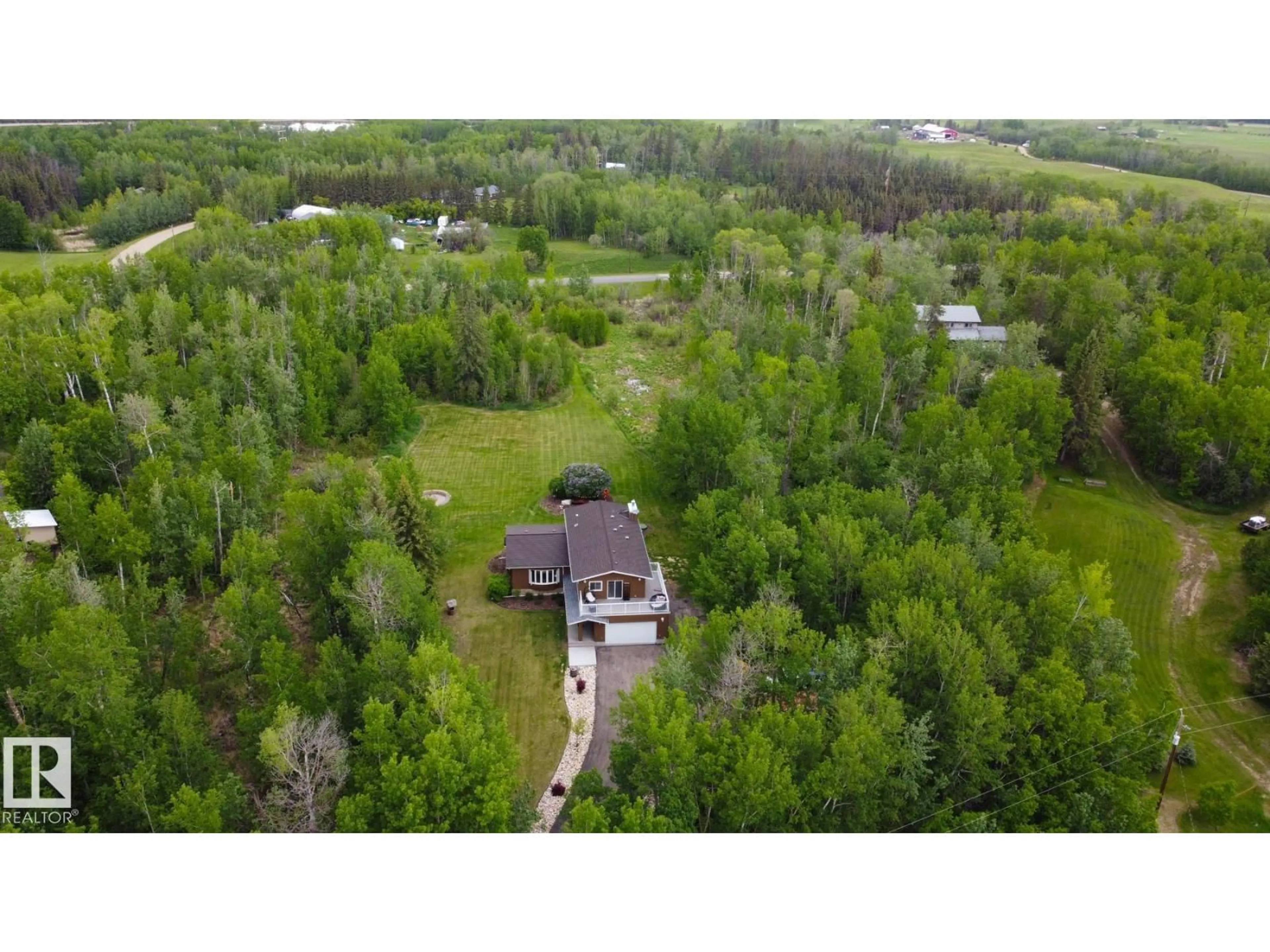 A pic from outside/outdoor area/front of a property/back of a property/a pic from drone, forest/trees view for 100 22549 TWP RD, Rural Leduc County Alberta T8C1H1