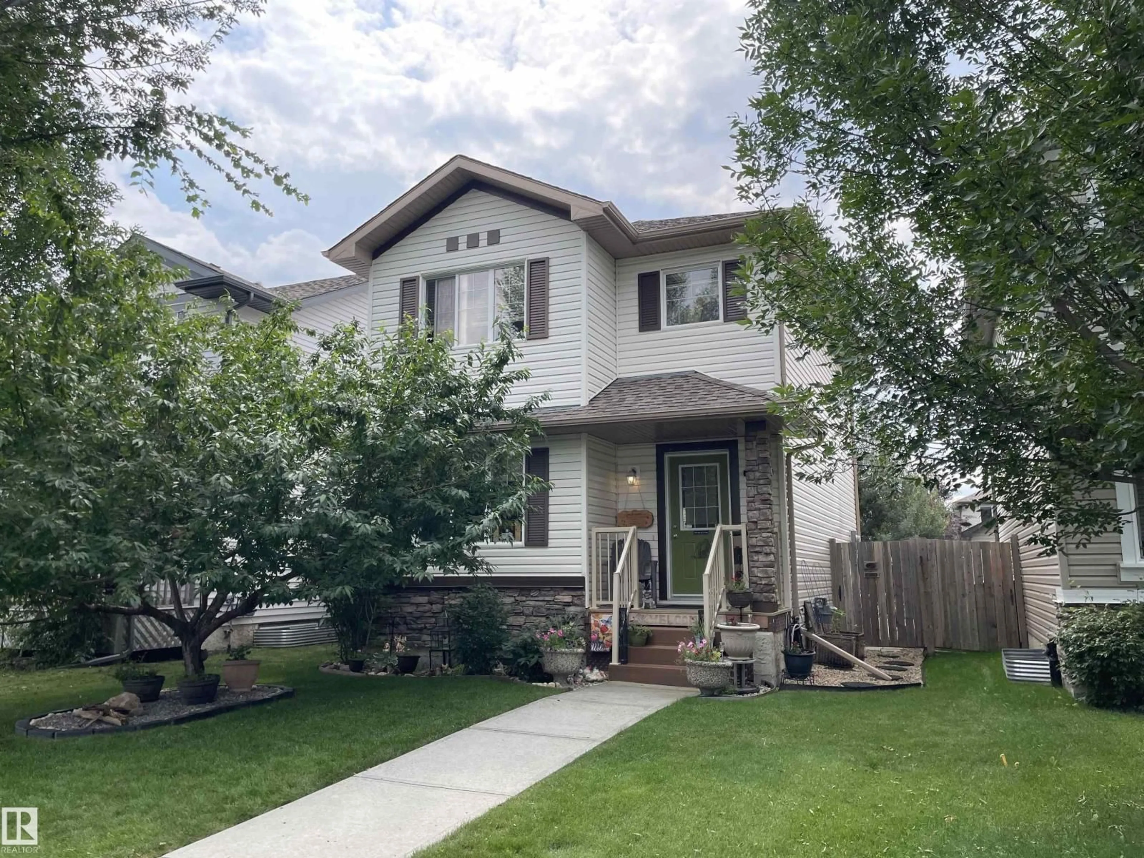 Home with vinyl exterior material, street for 9815 104 AV, Morinville Alberta T8R0C2