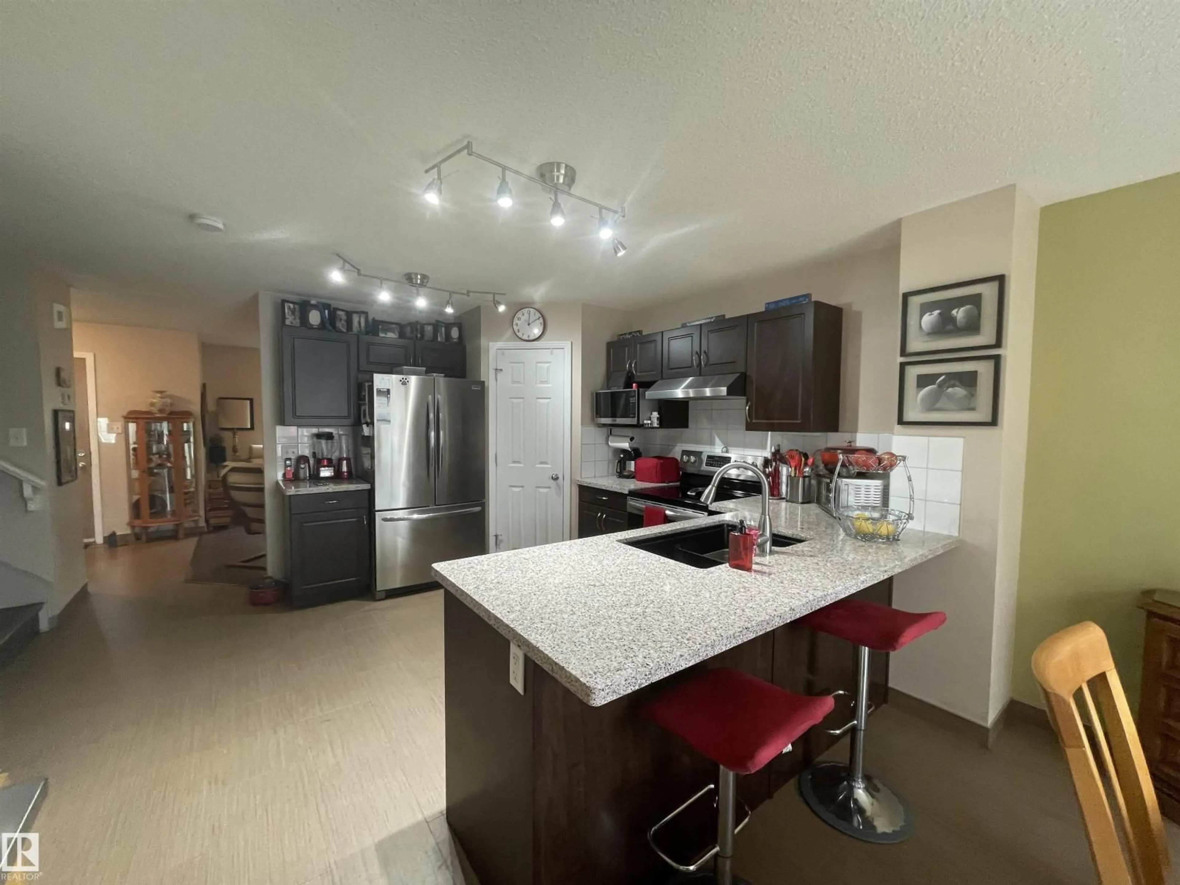 Open concept kitchen, ceramic/tile floor for 9815 104 AV, Morinville Alberta T8R0C2
