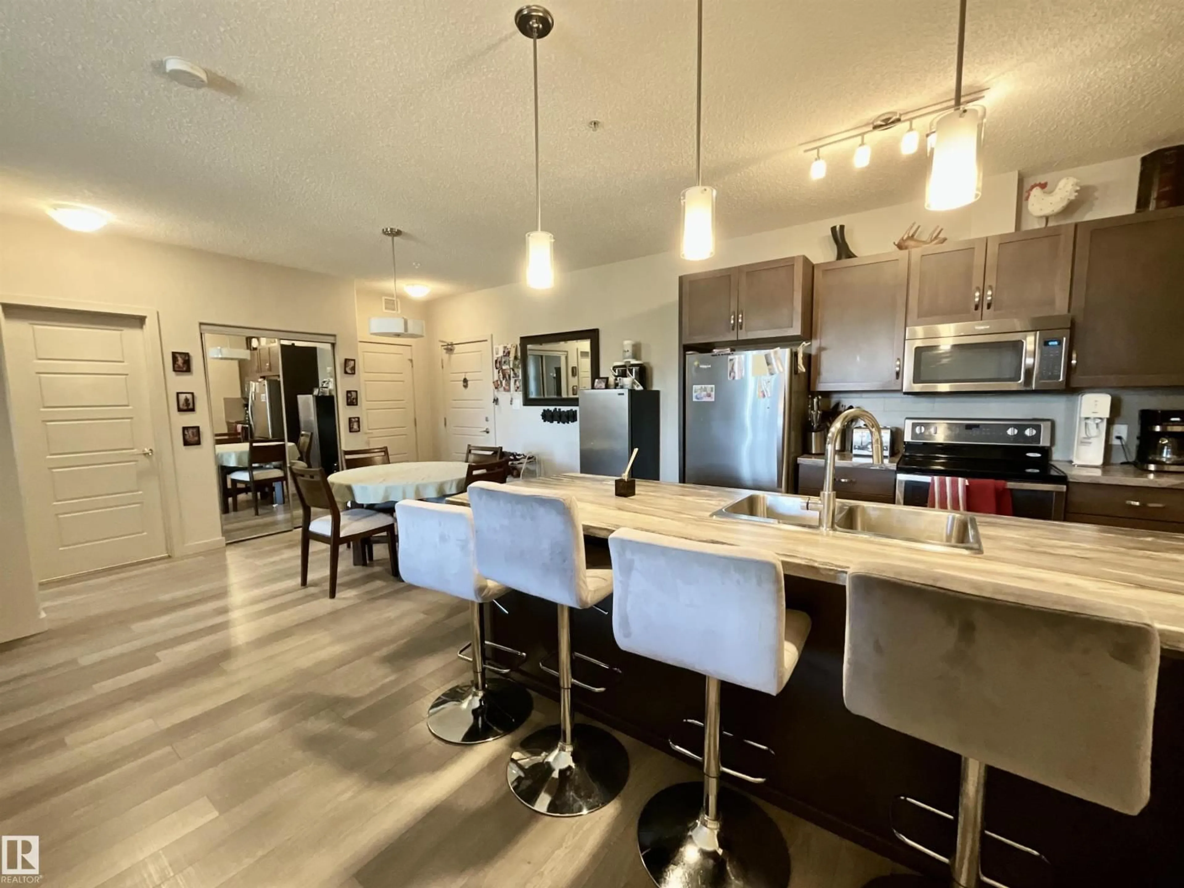 Open concept kitchen, unknown for 209 - 1004 ROSENTHAL BV, Edmonton Alberta T5T7C6