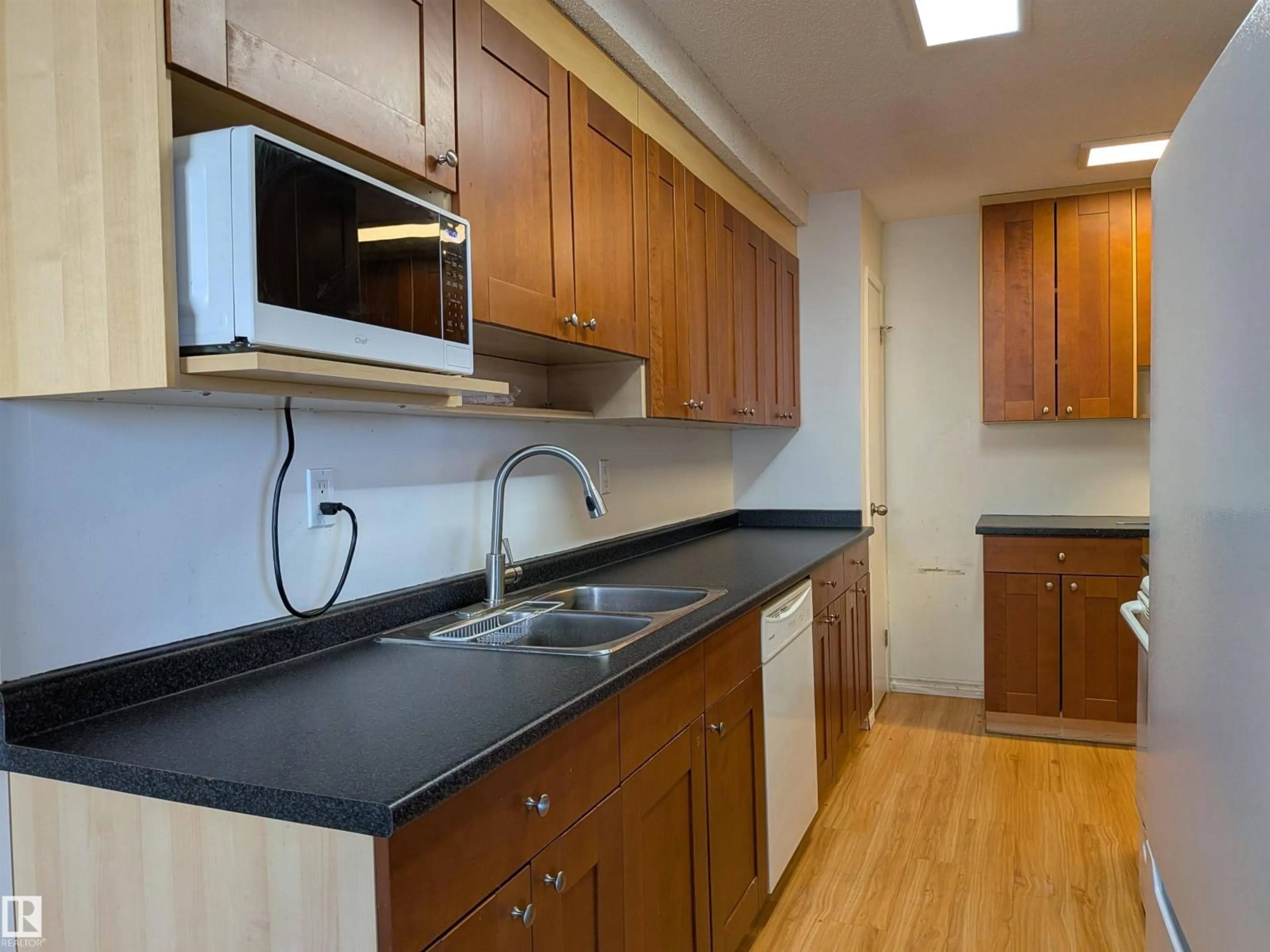 Standard kitchen, wood/laminate floor for #109 - 7220 144 AV NW, Edmonton Alberta T5C3E4