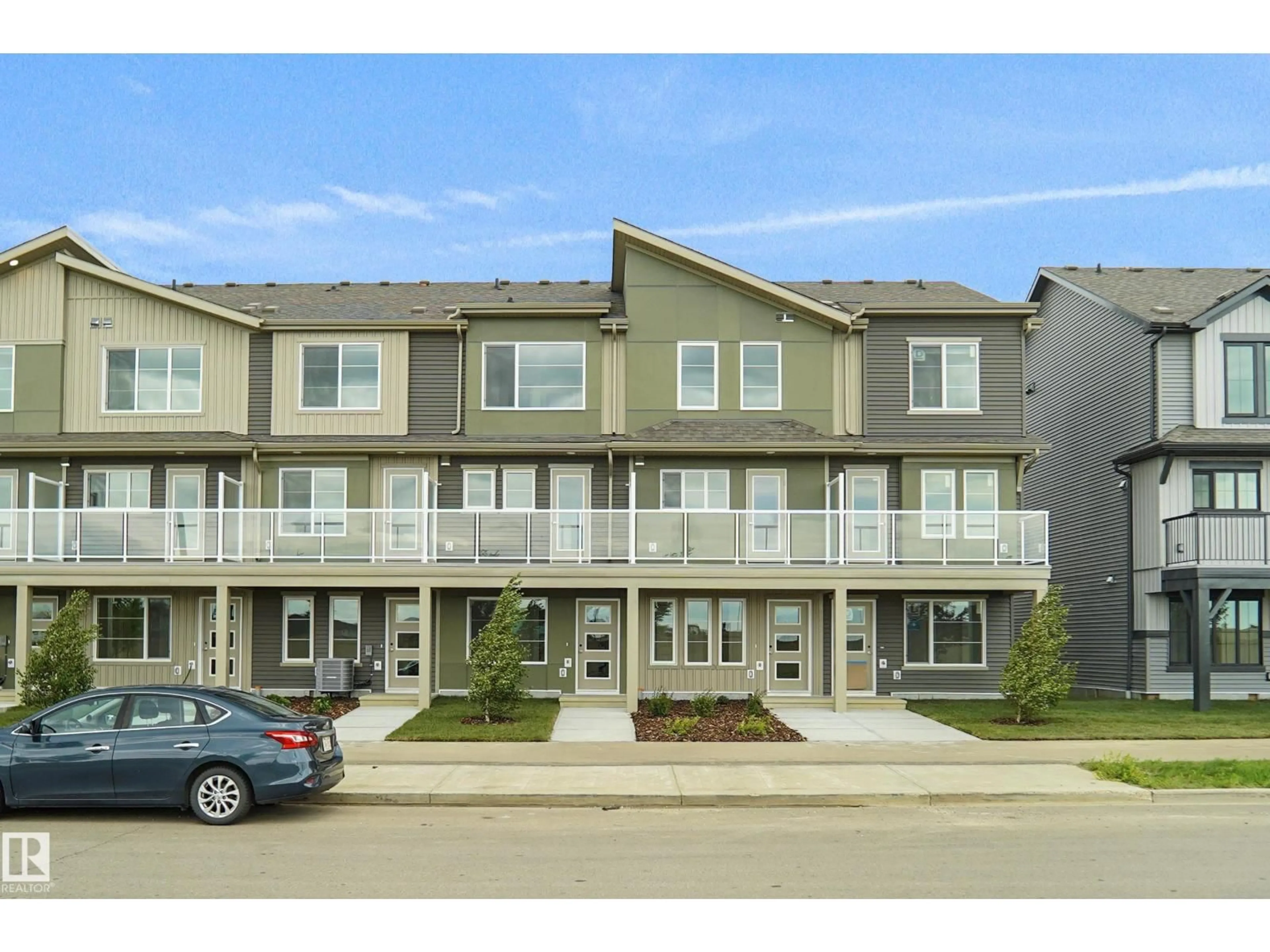 A pic from outside/outdoor area/front of a property/back of a property/a pic from drone, street for #100 - 3705 141 ST, Edmonton Alberta T6W3J2