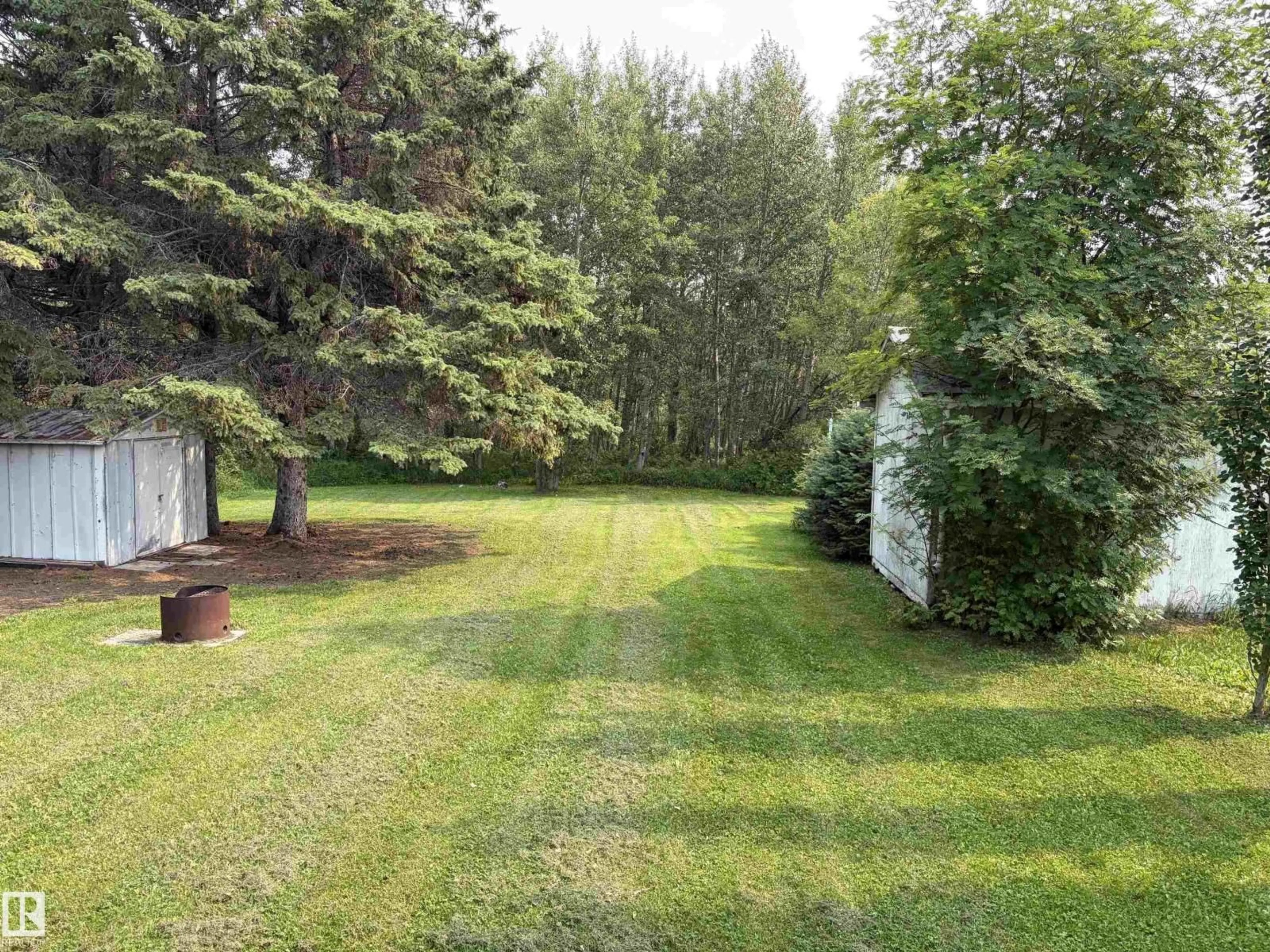 A pic from outside/outdoor area/front of a property/back of a property/a pic from drone, forest/trees view for 27 WICKS ST, Rural Leduc County Alberta T0C2P0