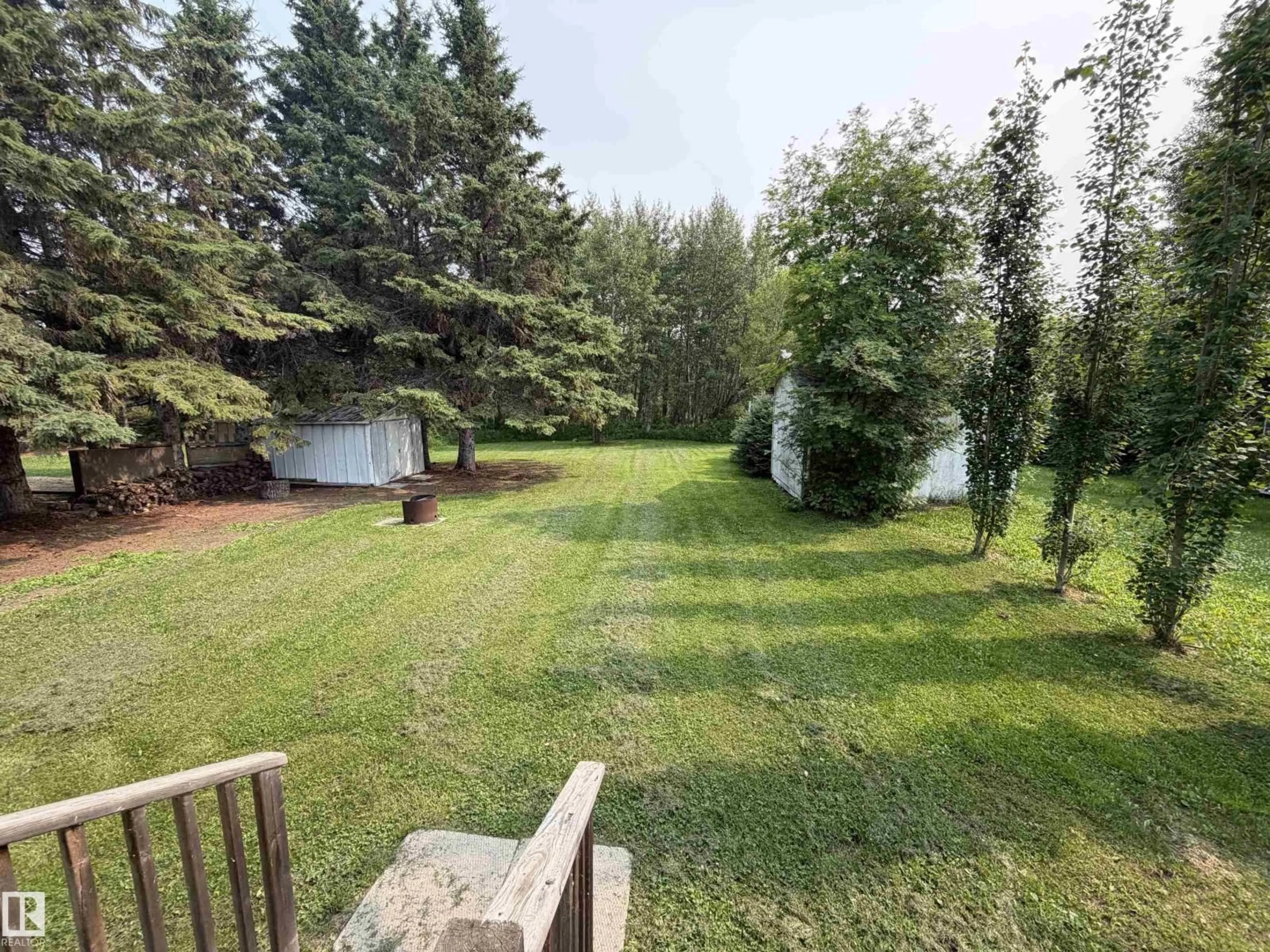 A pic from outside/outdoor area/front of a property/back of a property/a pic from drone, forest/trees view for 27 WICKS ST, Rural Leduc County Alberta T0C2P0