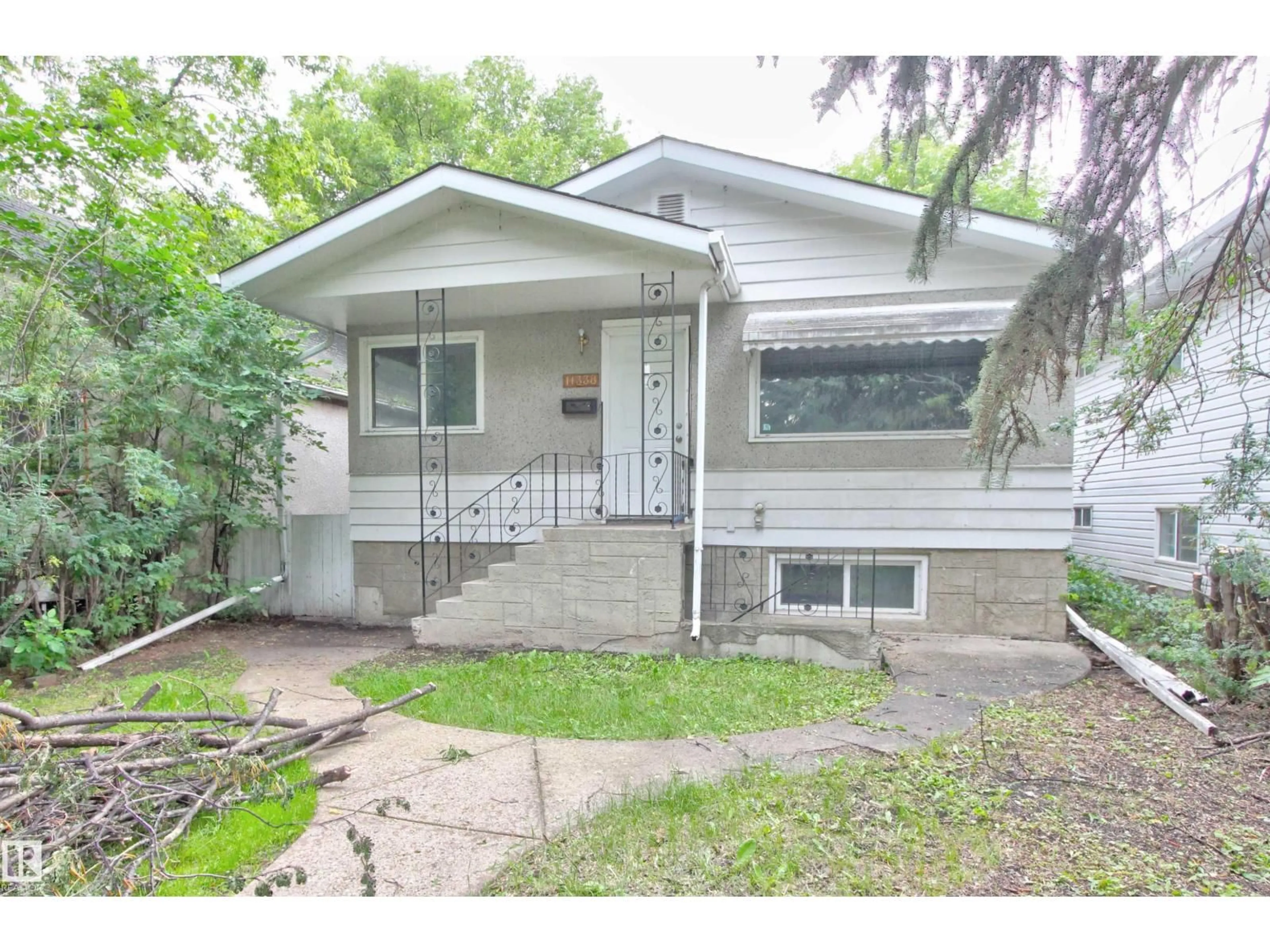 Home with vinyl exterior material, street for NW - 11338 85 ST, Edmonton Alberta T5B3C8