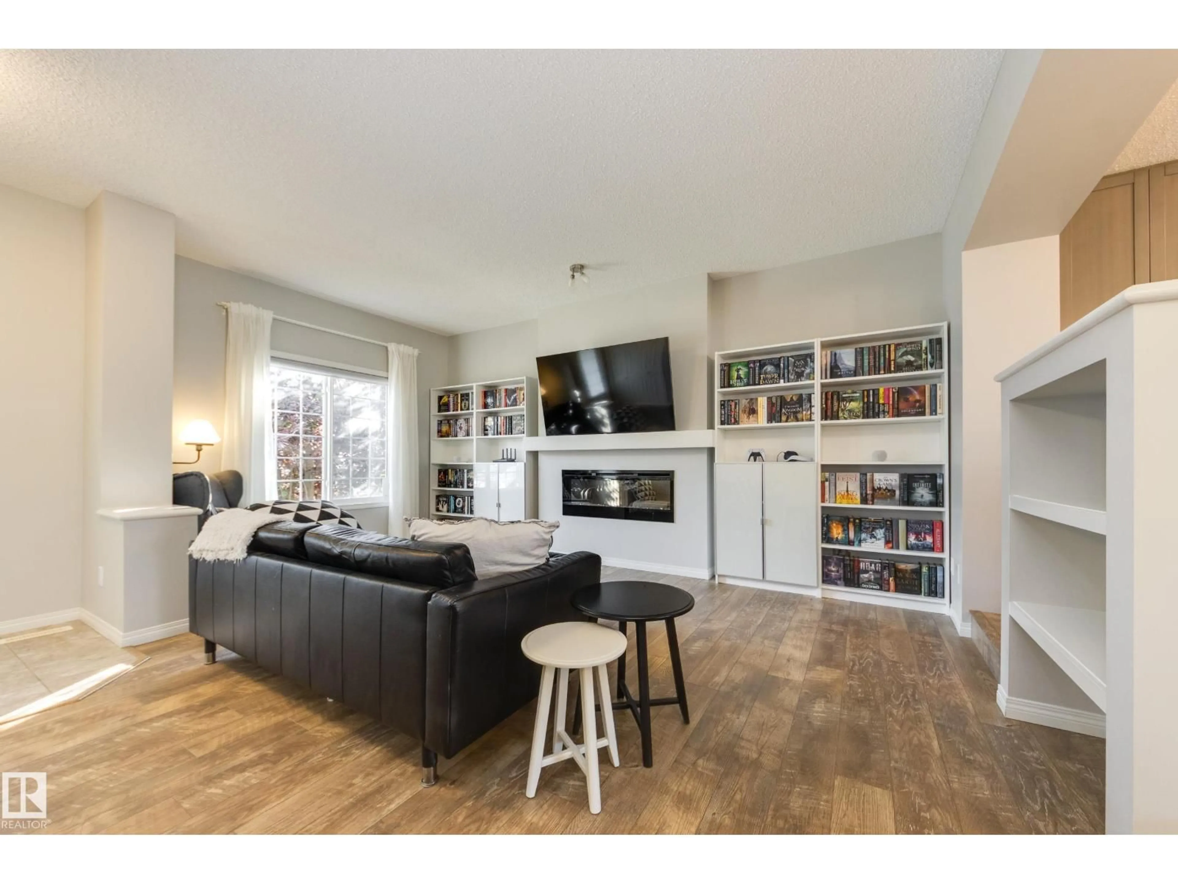 Living room with furniture, wood/laminate floor for 1241 CHAPPELLE BV, Edmonton Alberta T6W3R1