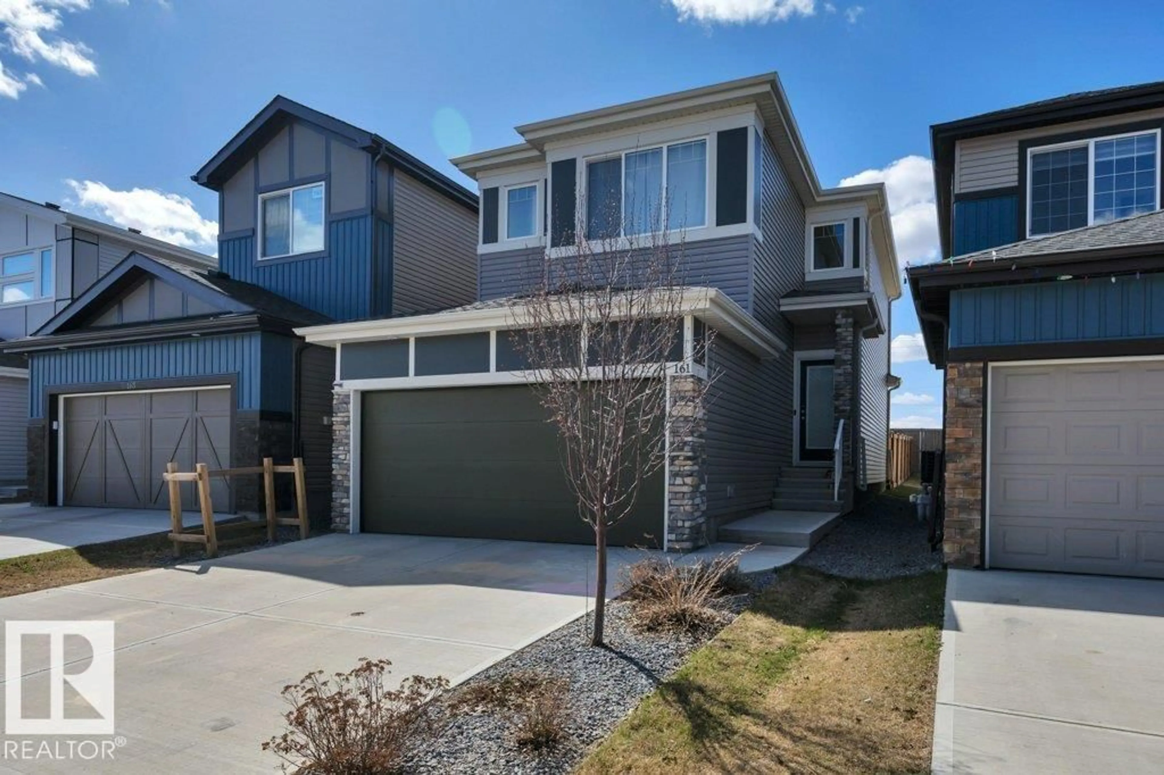 Home with vinyl exterior material, street for 161 LARCH CR, Leduc Alberta T9E1N3