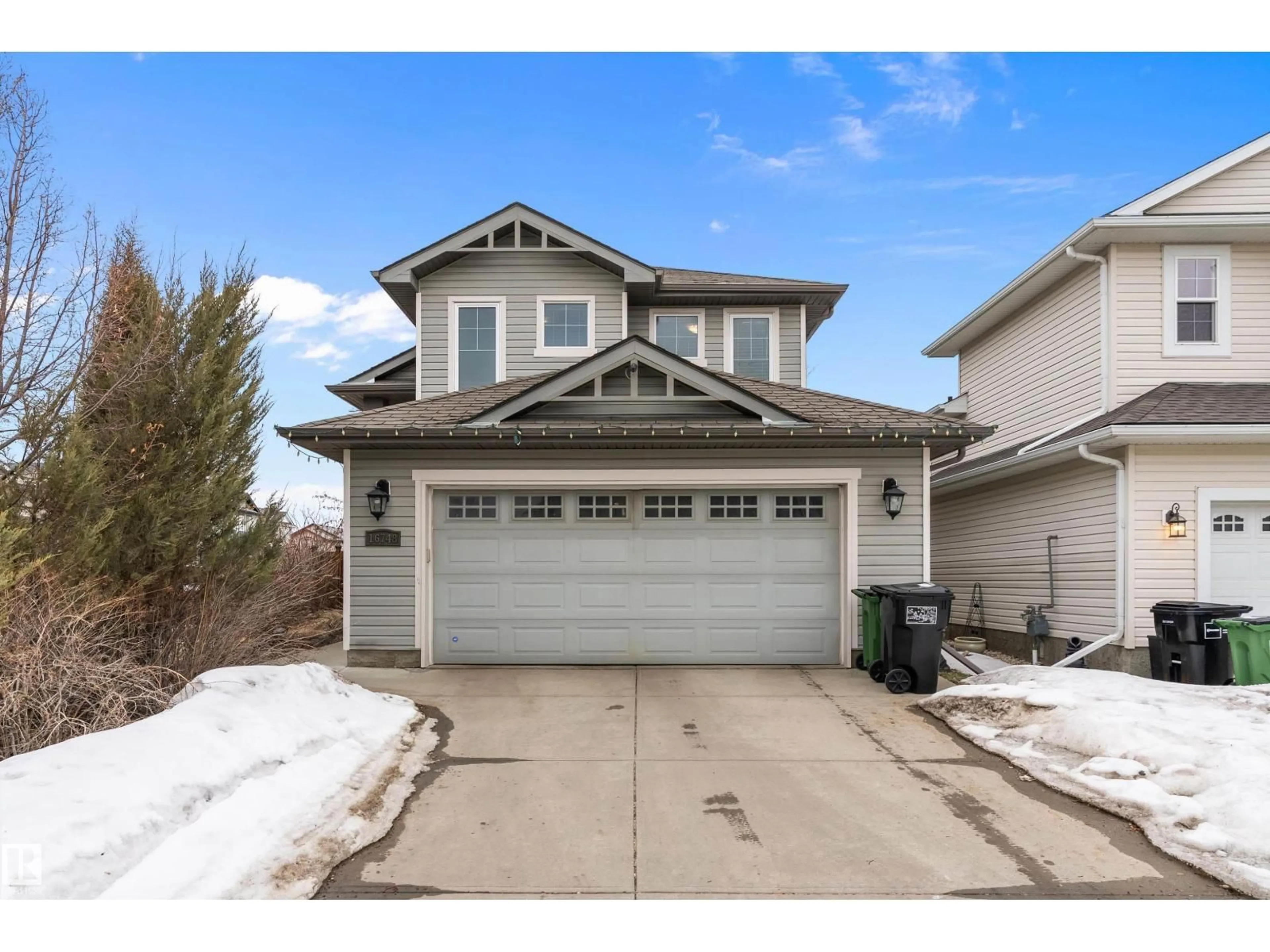 Home with vinyl exterior material, street for NW - 16748 118 ST, Edmonton Alberta T5X0B1