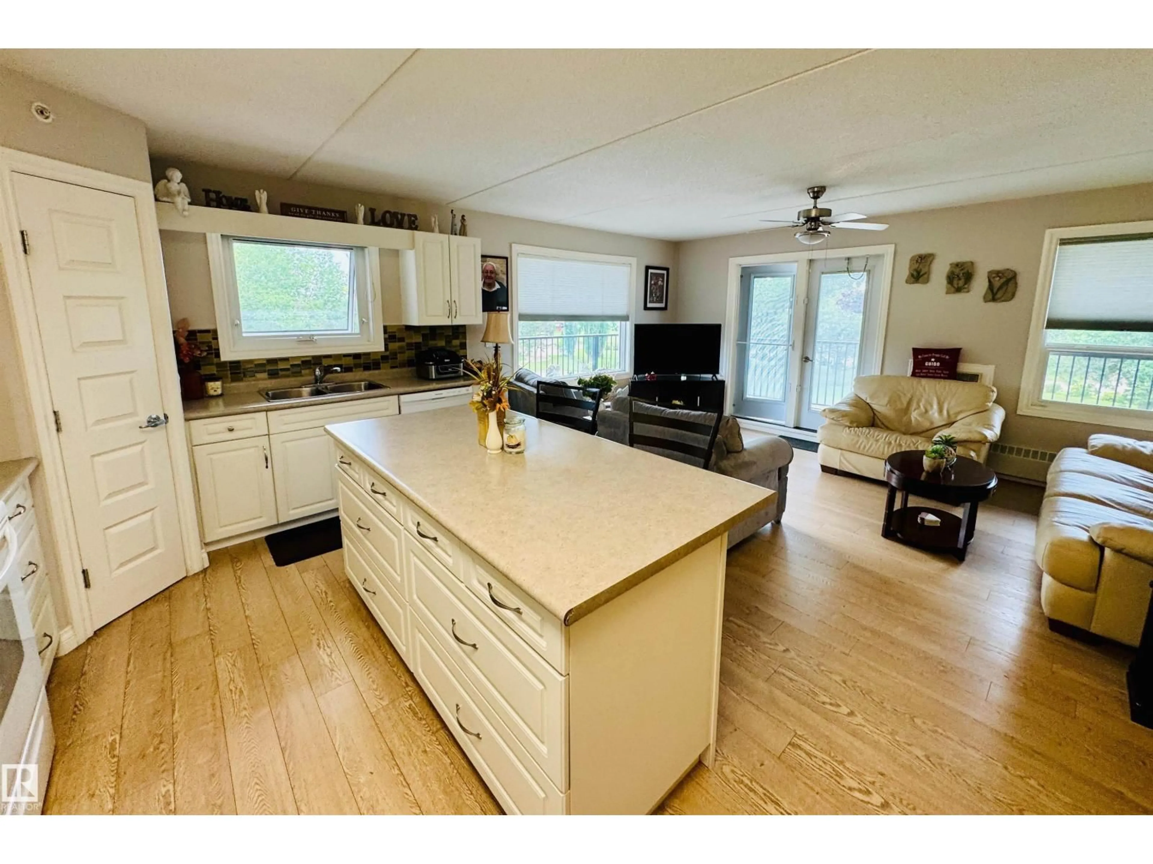 Open concept kitchen, wood/laminate floor for 208 - 4614A LAKESHORE DRIVE, St. Paul Town Alberta T0A3A3