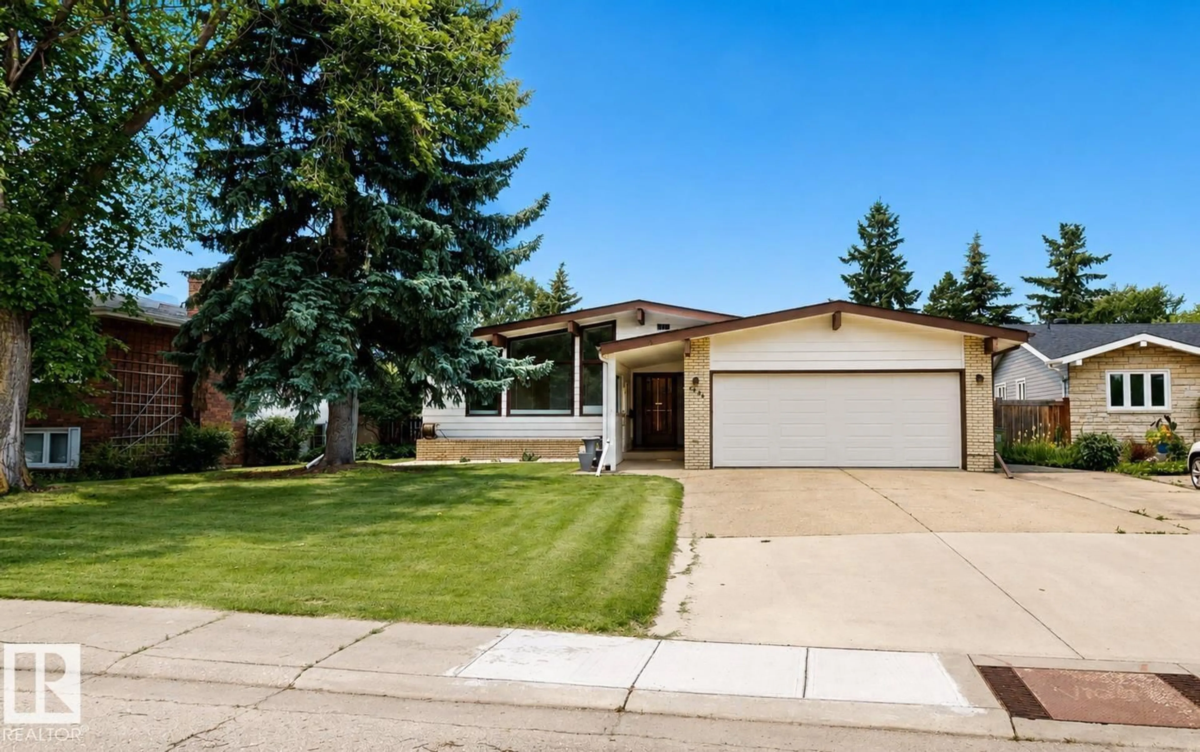 Home with vinyl exterior material, street for NW - 3536 105A ST, Edmonton Alberta T6J2K8
