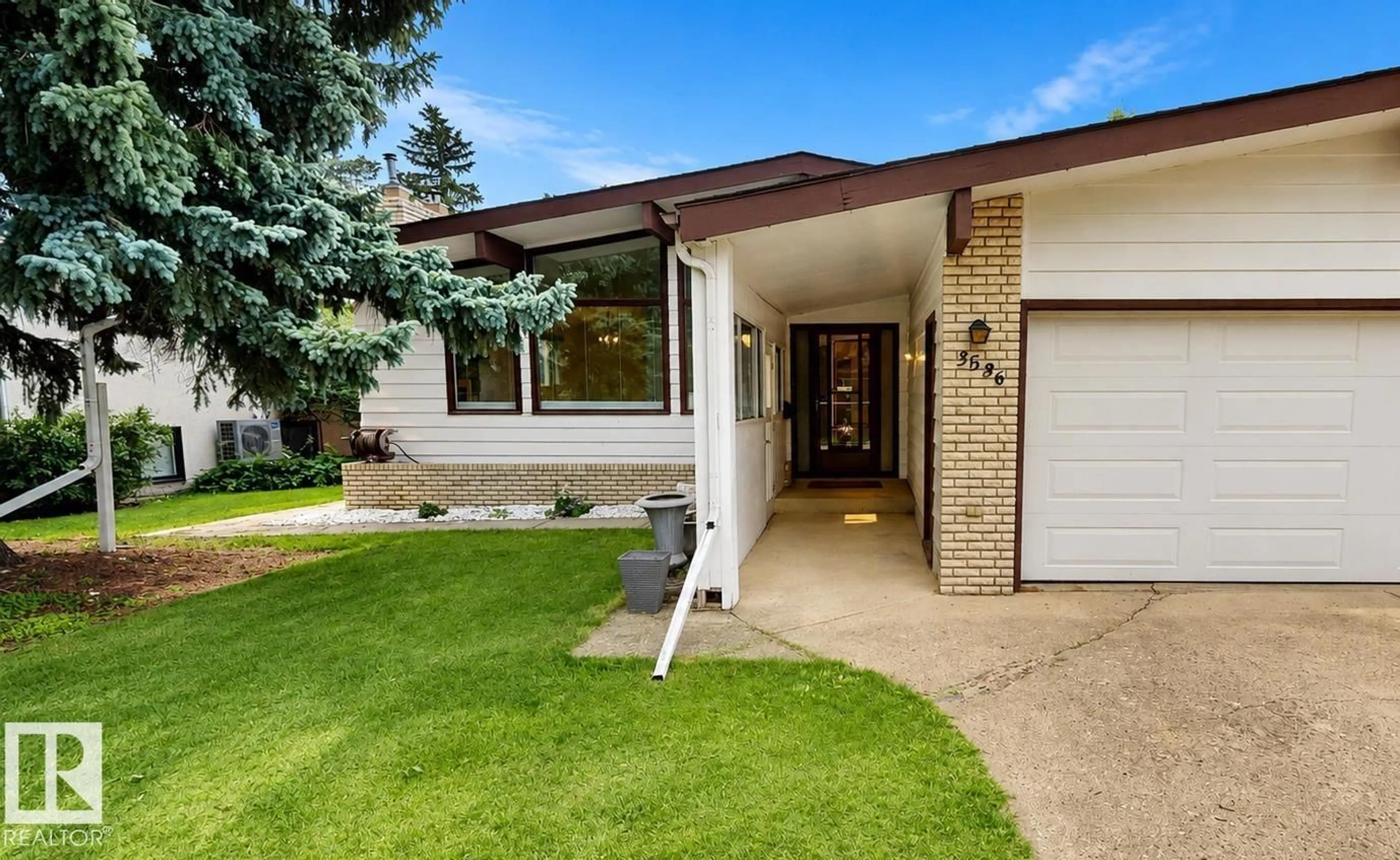 Home with brick exterior material, street for NW - 3536 105A ST, Edmonton Alberta T6J2K8