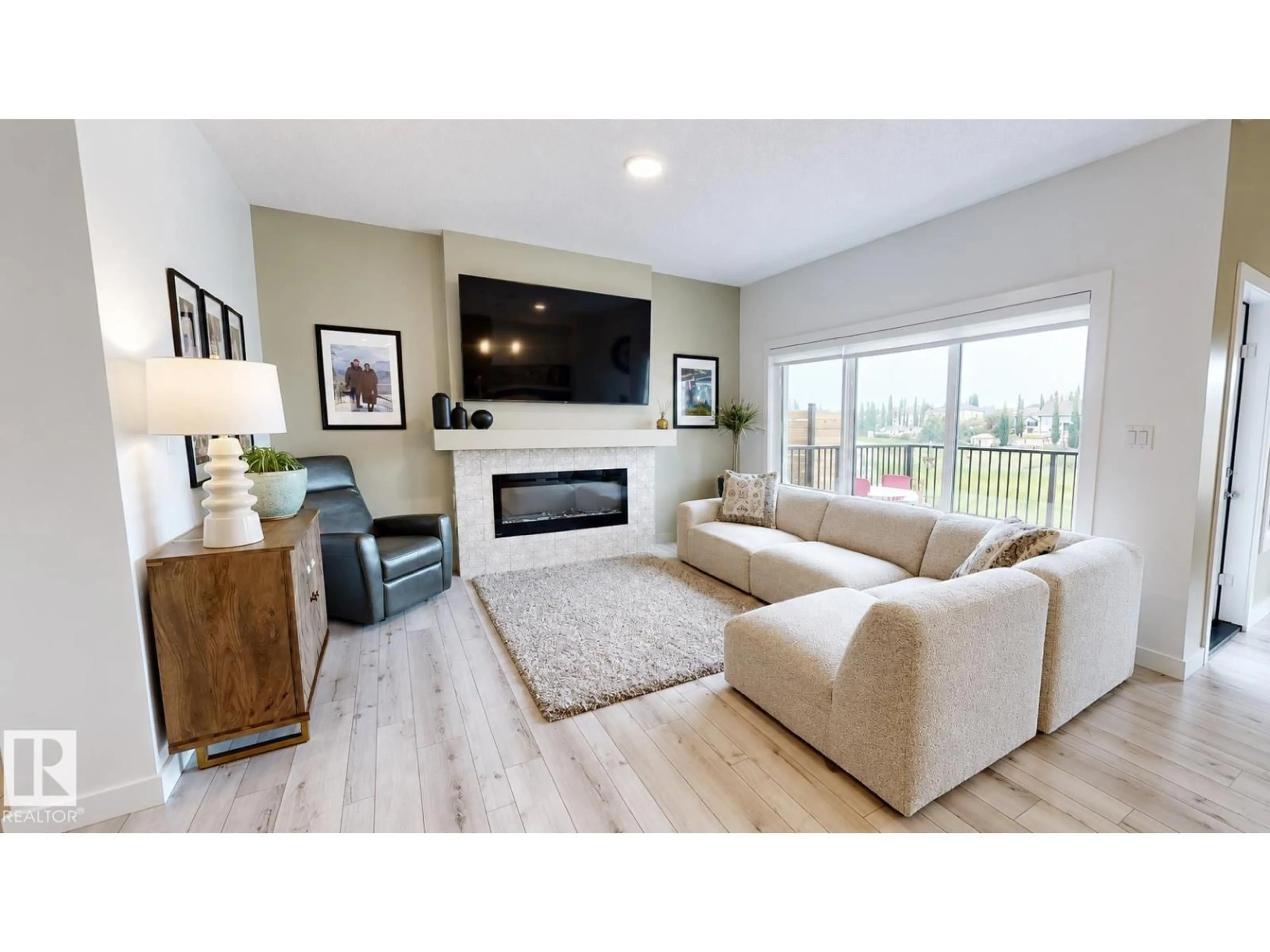 Living room with furniture, wood/laminate floor for 4601 62 ST, Beaumont Alberta T4X2Z2