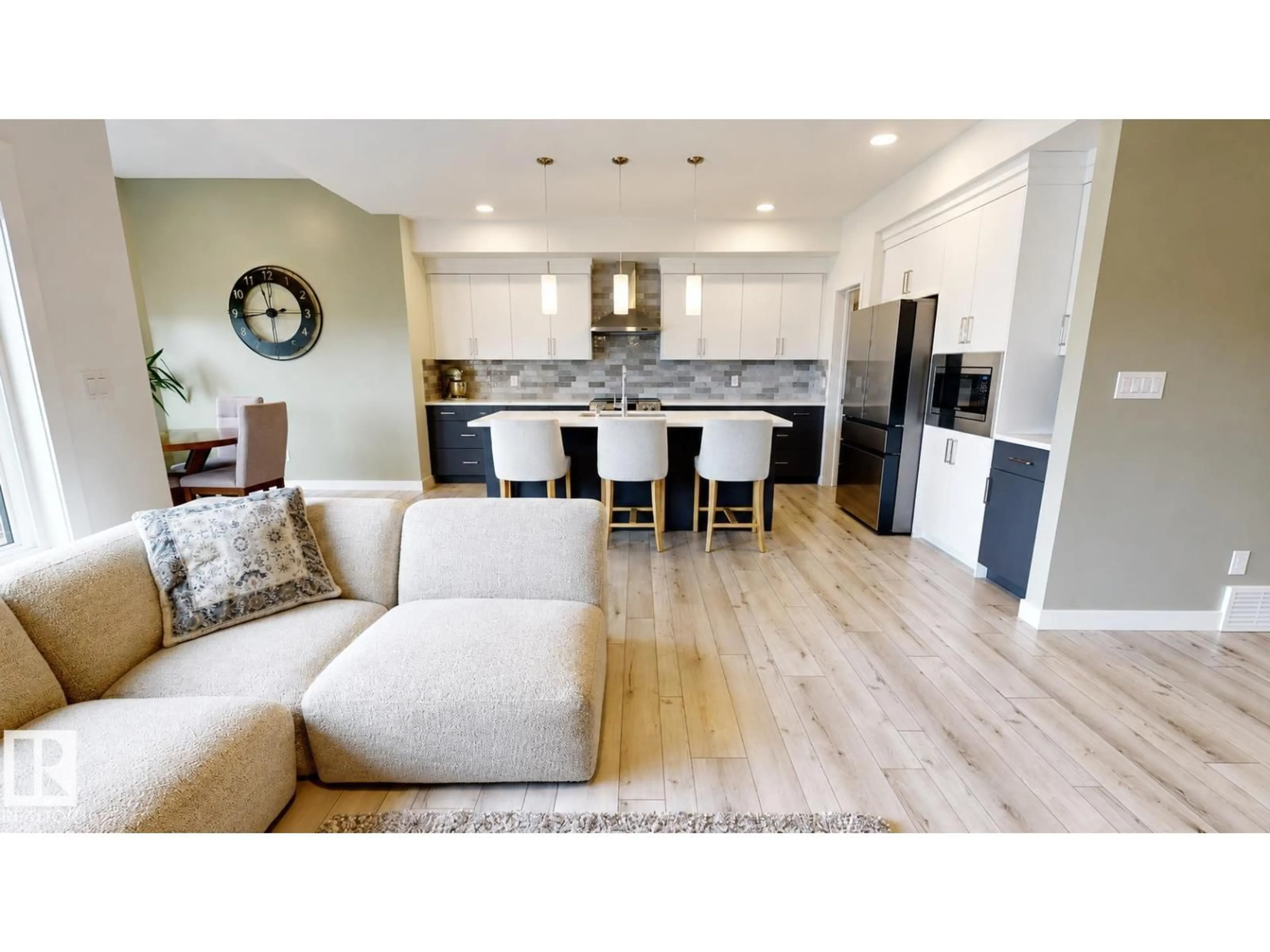 Open concept kitchen, wood/laminate floor for 4601 62 ST, Beaumont Alberta T4X2Z2