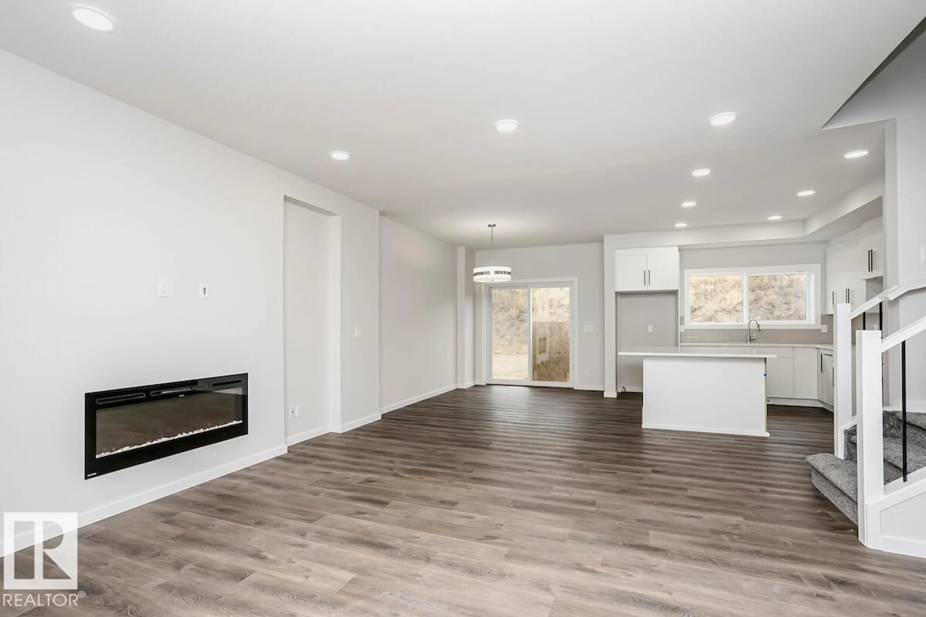 Open concept kitchen, wood/laminate floor for SW - 2815 62 ST, Edmonton Alberta T6X3G4