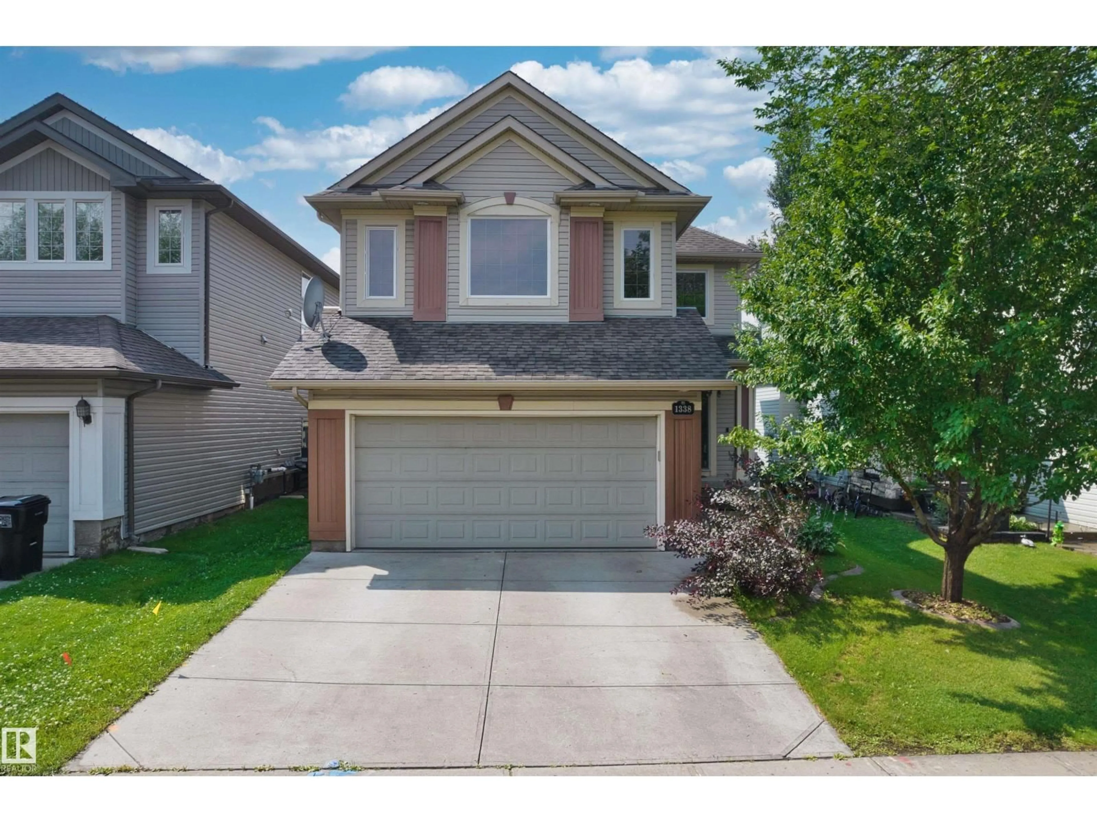 Home with vinyl exterior material, street for 1338 RUTHERFORD RD, Edmonton Alberta T6W1P3
