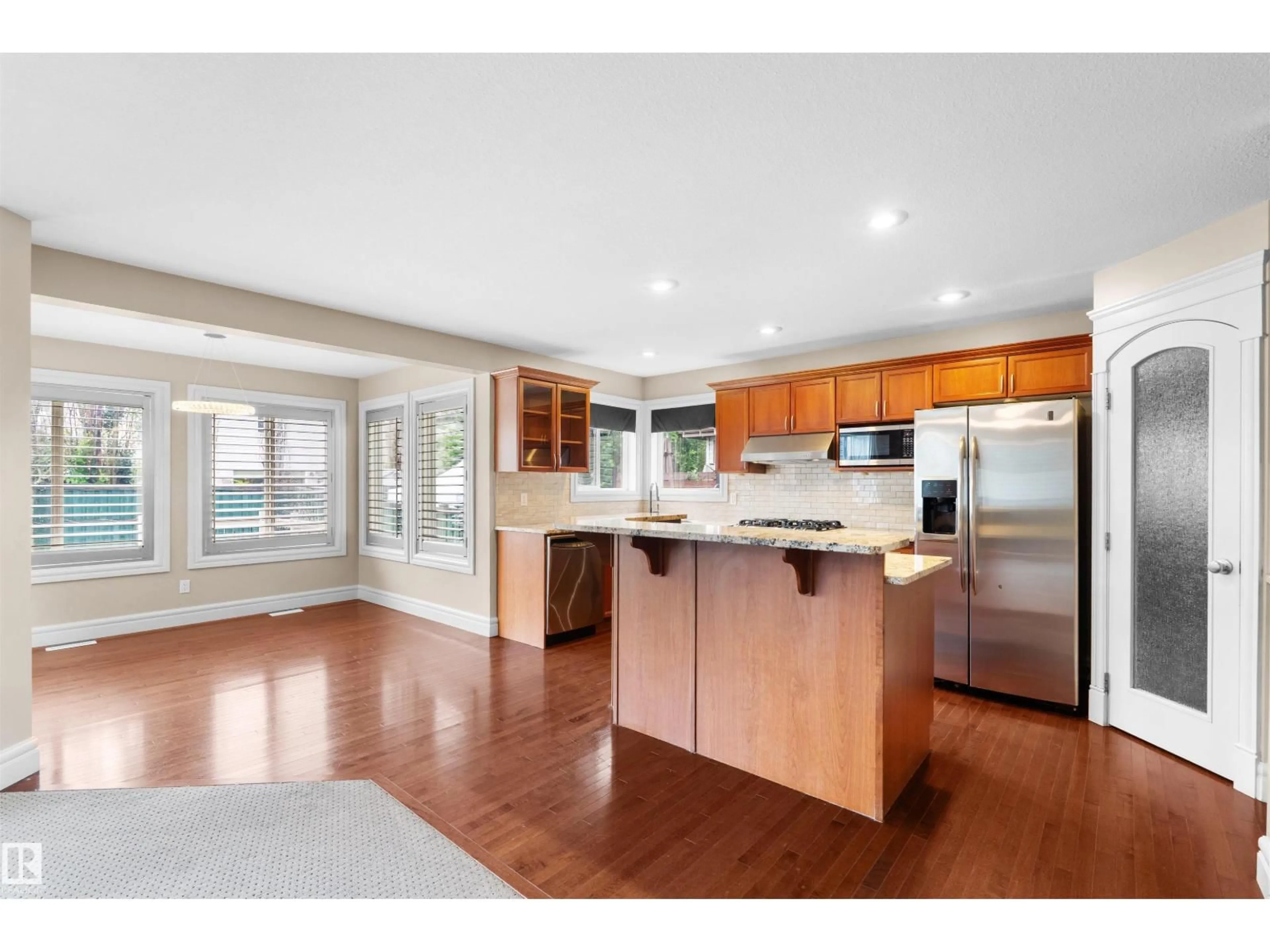 Open concept kitchen, wood/laminate floor for 1338 RUTHERFORD RD, Edmonton Alberta T6W1P3