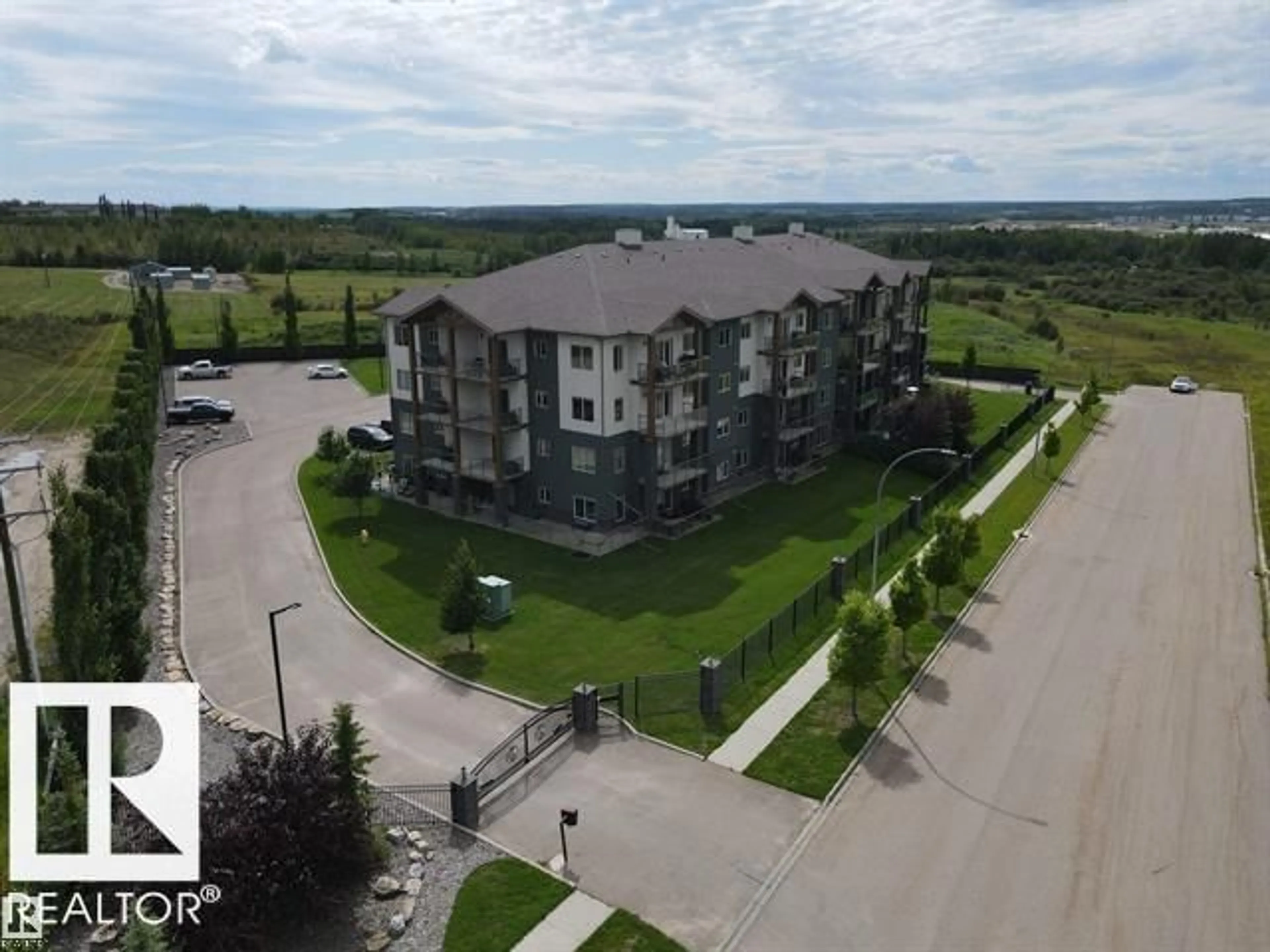 A pic from outside/outdoor area/front of a property/back of a property/a pic from drone, building for 201 - 5201 BROUGHAM DRIVE, Drayton Valley Alberta T7A0C8