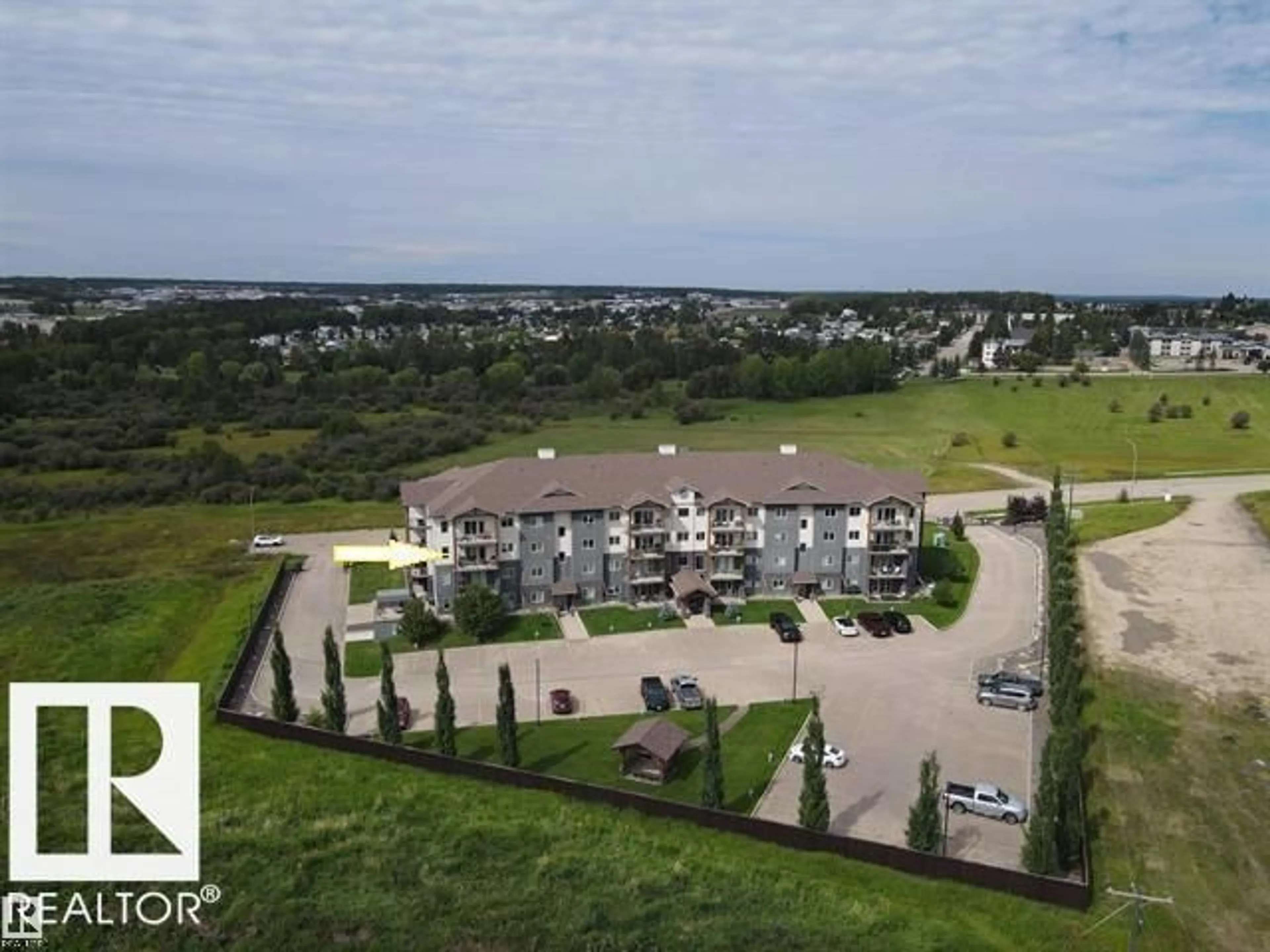 A pic from outside/outdoor area/front of a property/back of a property/a pic from drone, water/lake/river/ocean view for 201 - 5201 BROUGHAM DRIVE, Drayton Valley Alberta T7A0C8