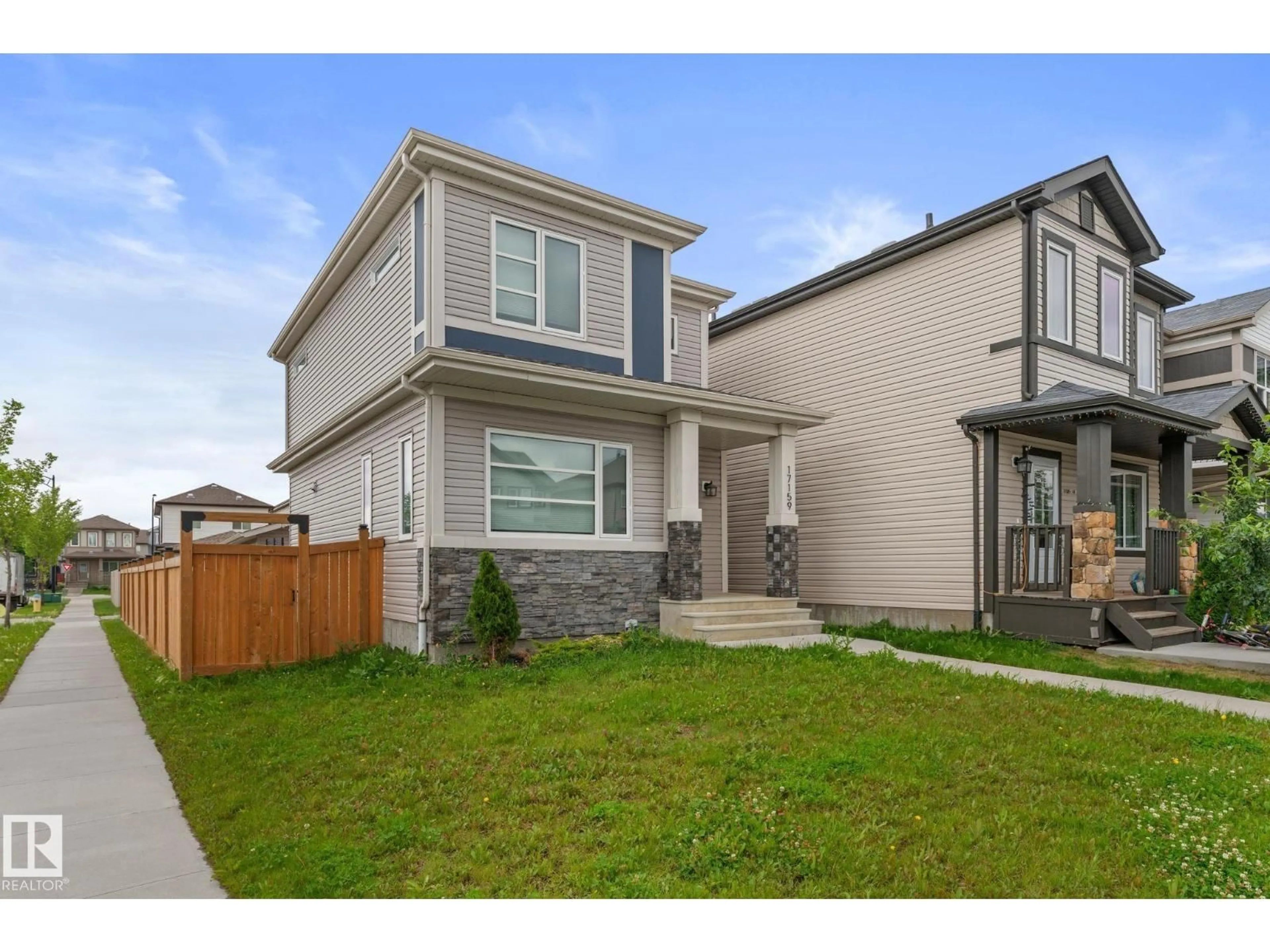 Home with vinyl exterior material, street for 17159 49 ST, Edmonton Alberta T5Z0J1