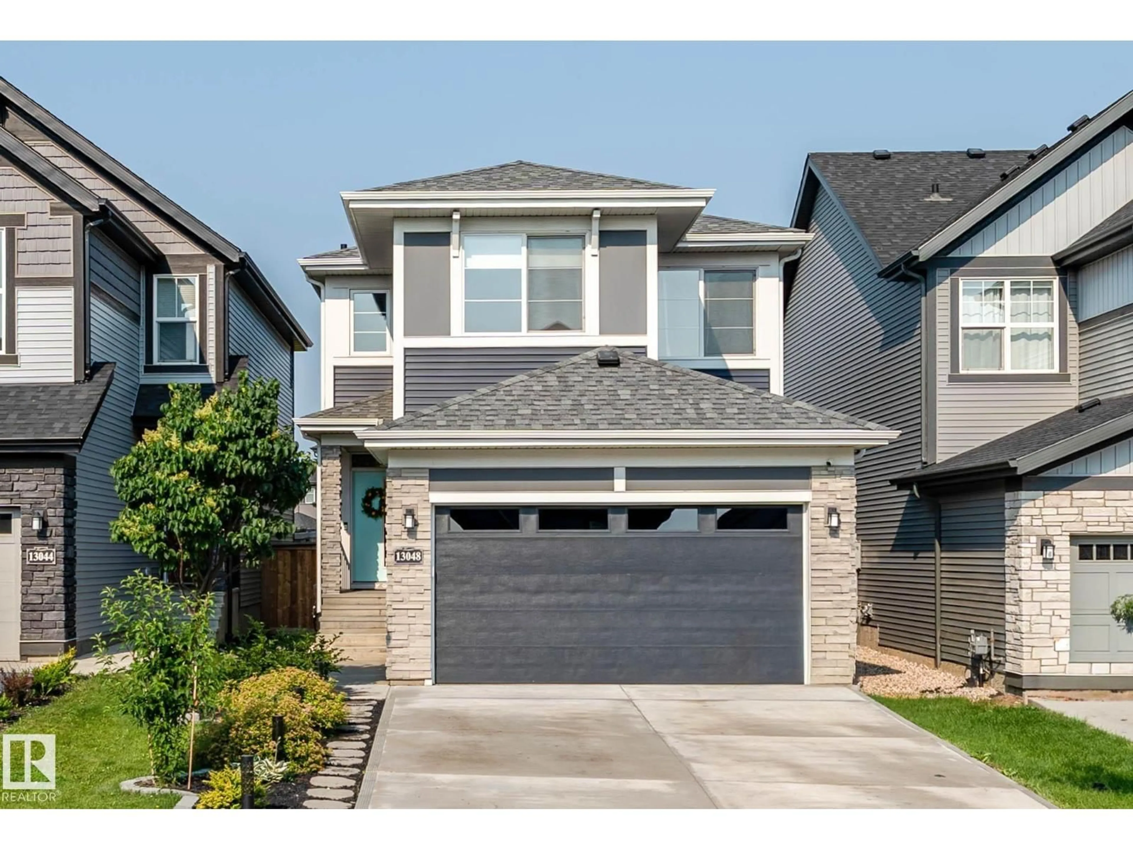 Home with vinyl exterior material, street for NW - 13048 211 ST, Edmonton Alberta T5S0P5